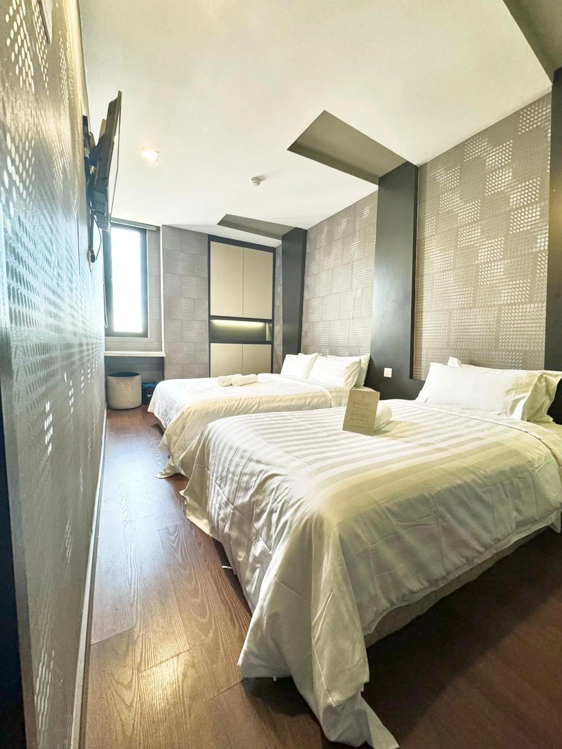 Bed in Chariton Hotel Nusa Bestari