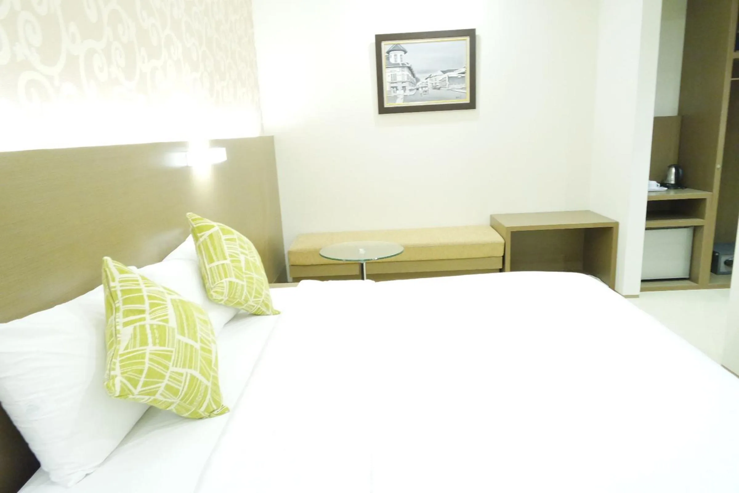 Seating area, Bed in Yokotel Hotel