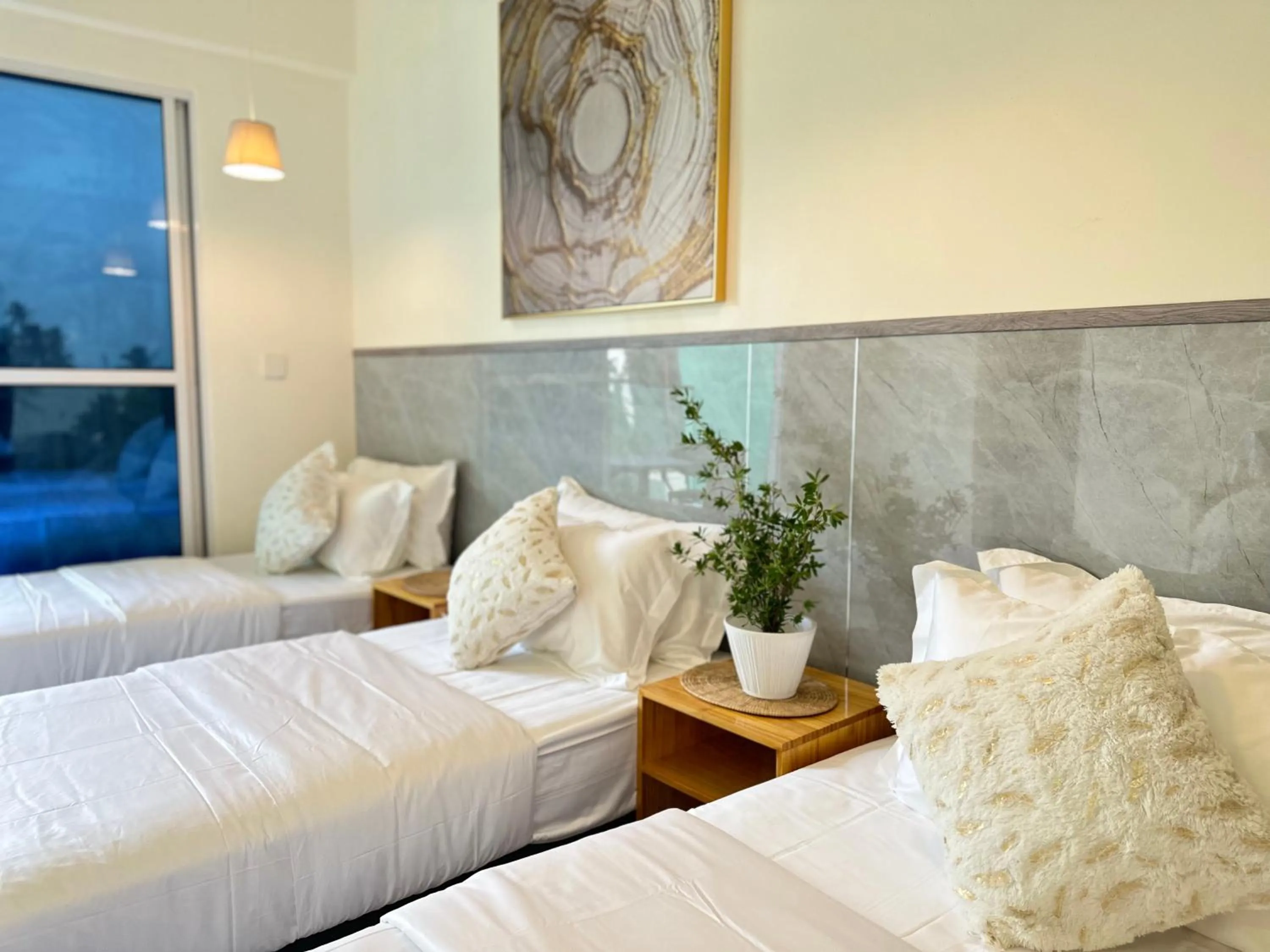 Bed in YUVi Blue Maldives & spa