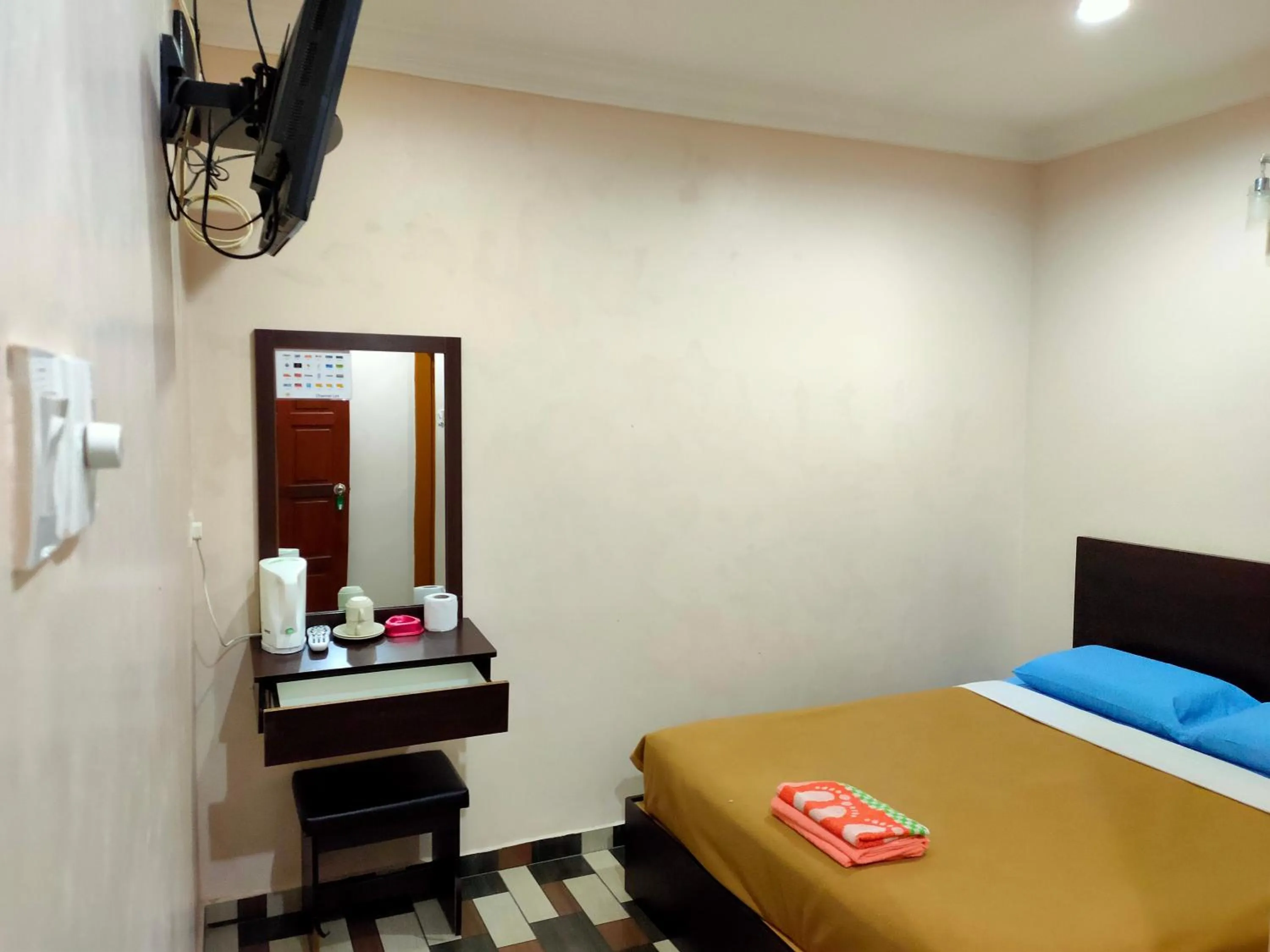 Bed in Ria Cameron Hotel