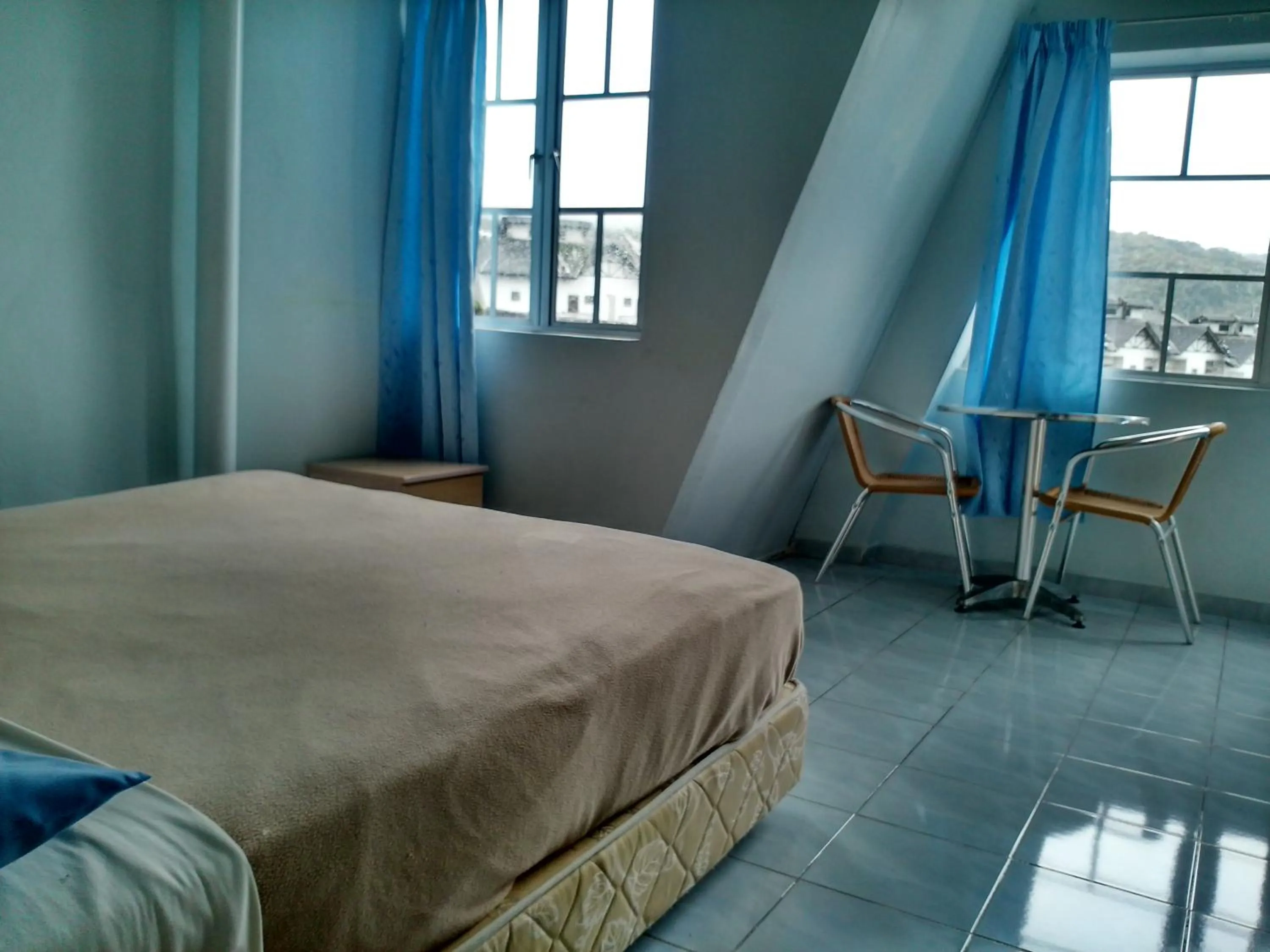 Bed in Ria Cameron Hotel