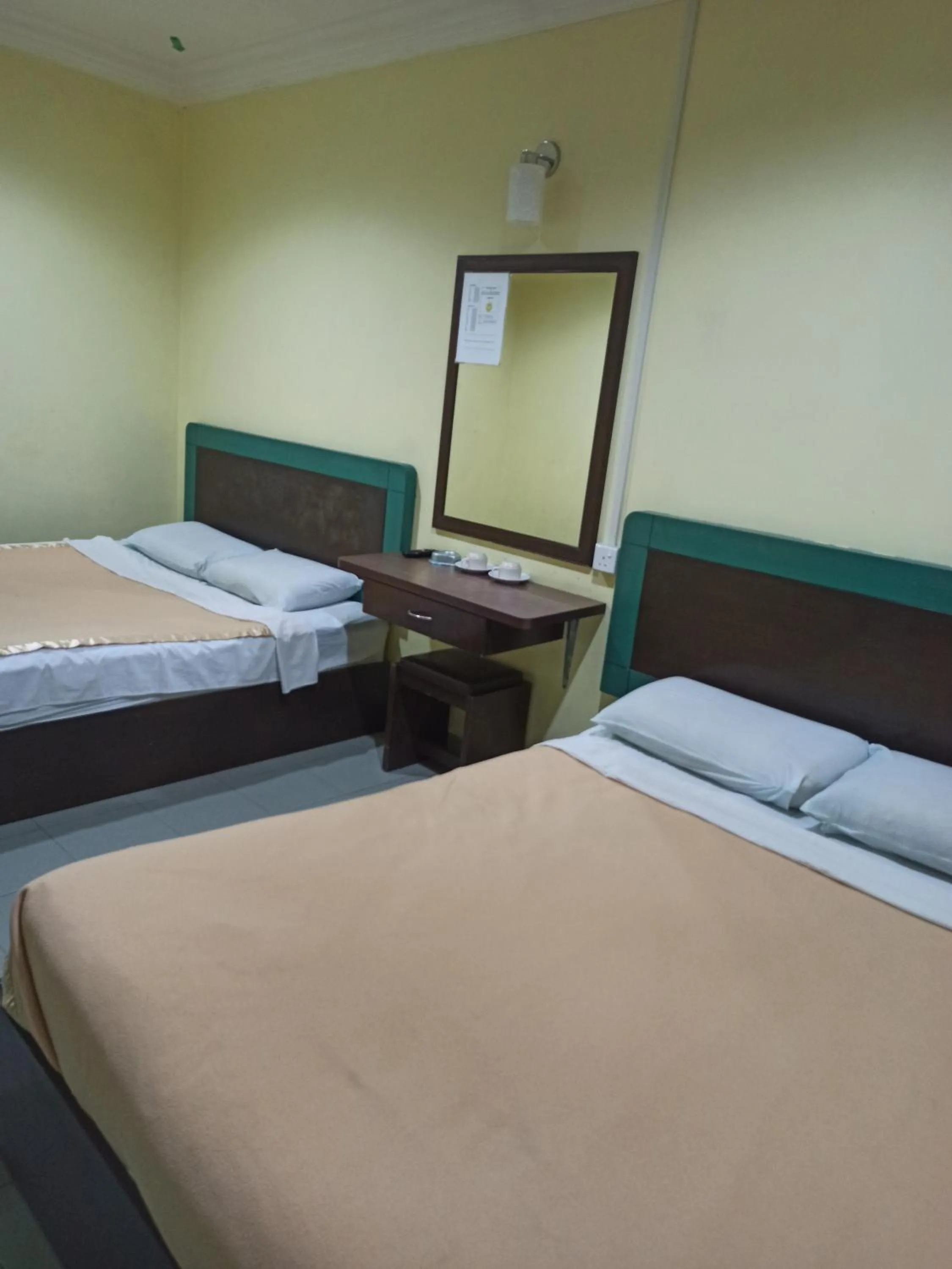 Bed in Ria Cameron Hotel