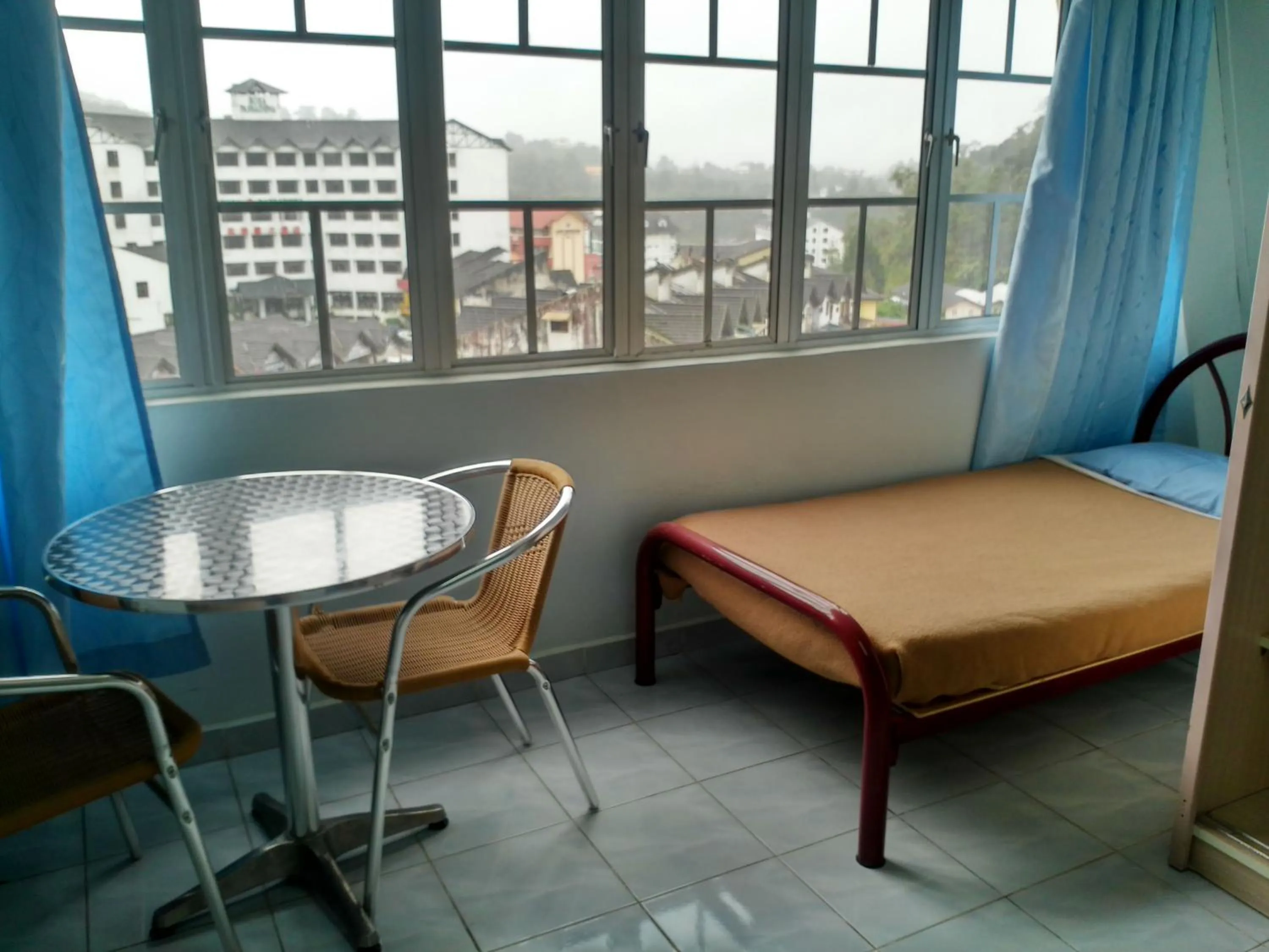 Bed in Ria Cameron Hotel