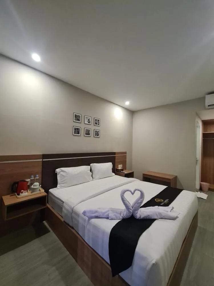 Bed in Nio Garden Hotel