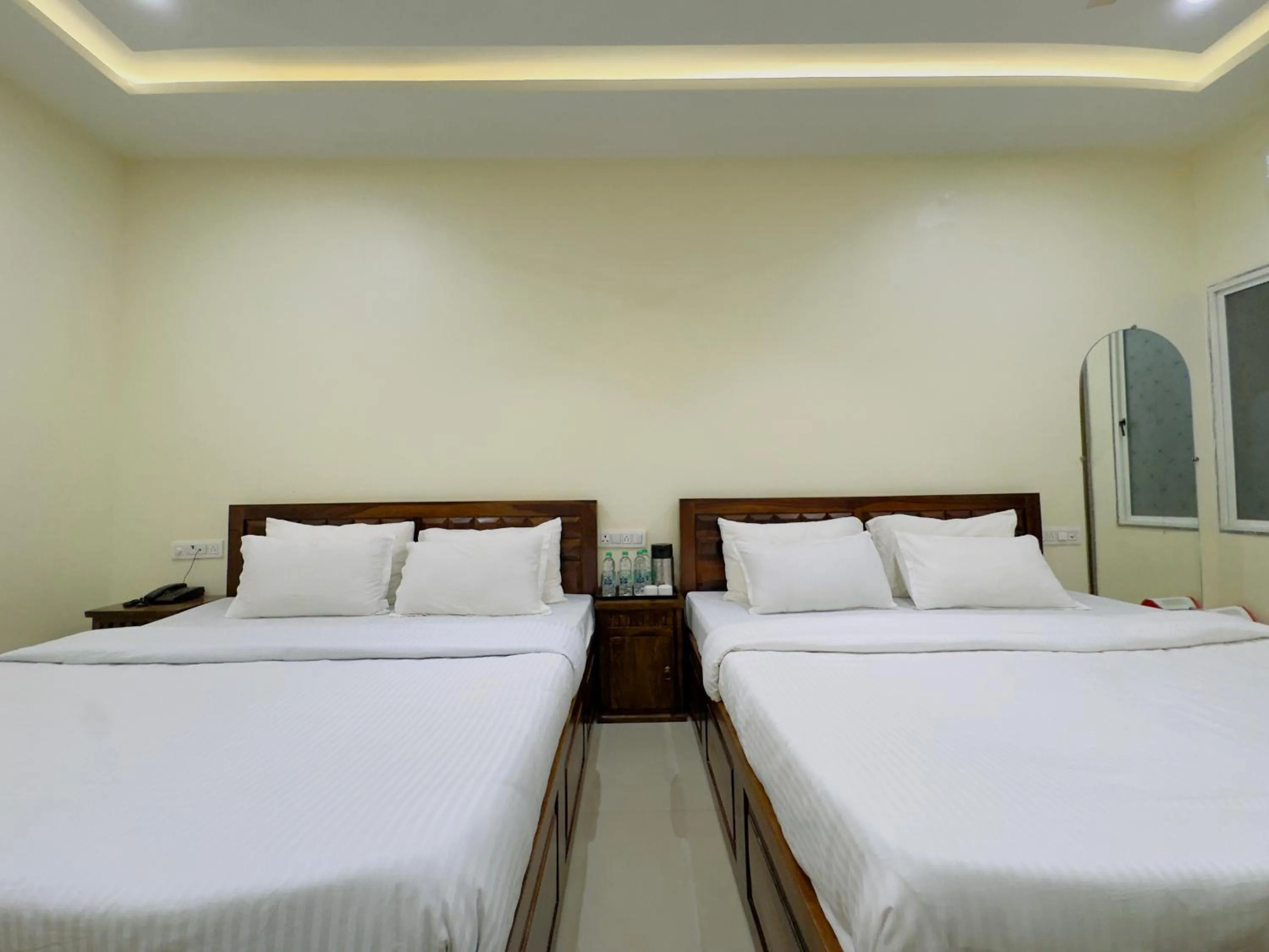 Photo of the whole room, Bed in Hotel Jyotirlinga- One Way Drop to Mahakal Temple