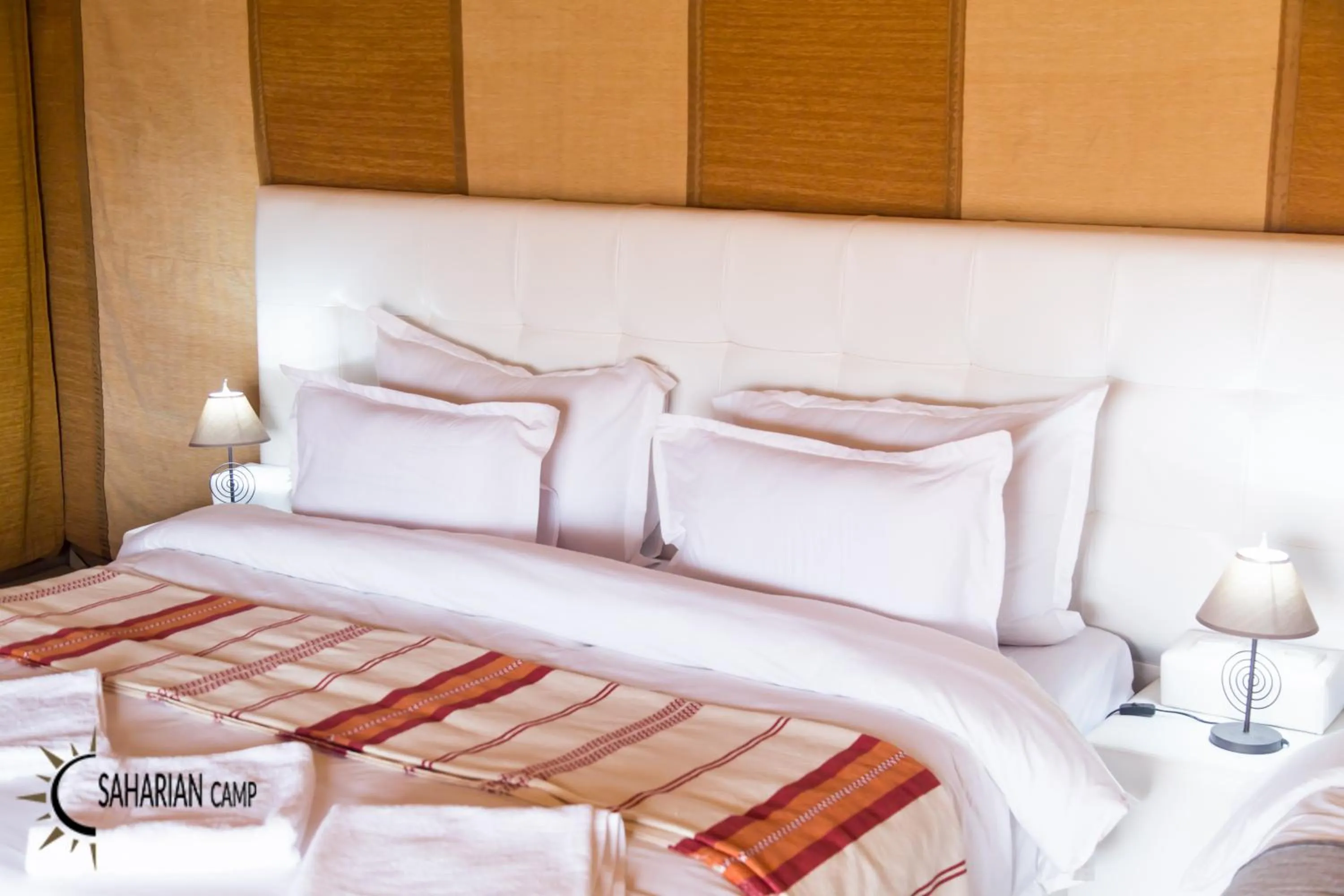 Bed in Merzouga Luxury Camp