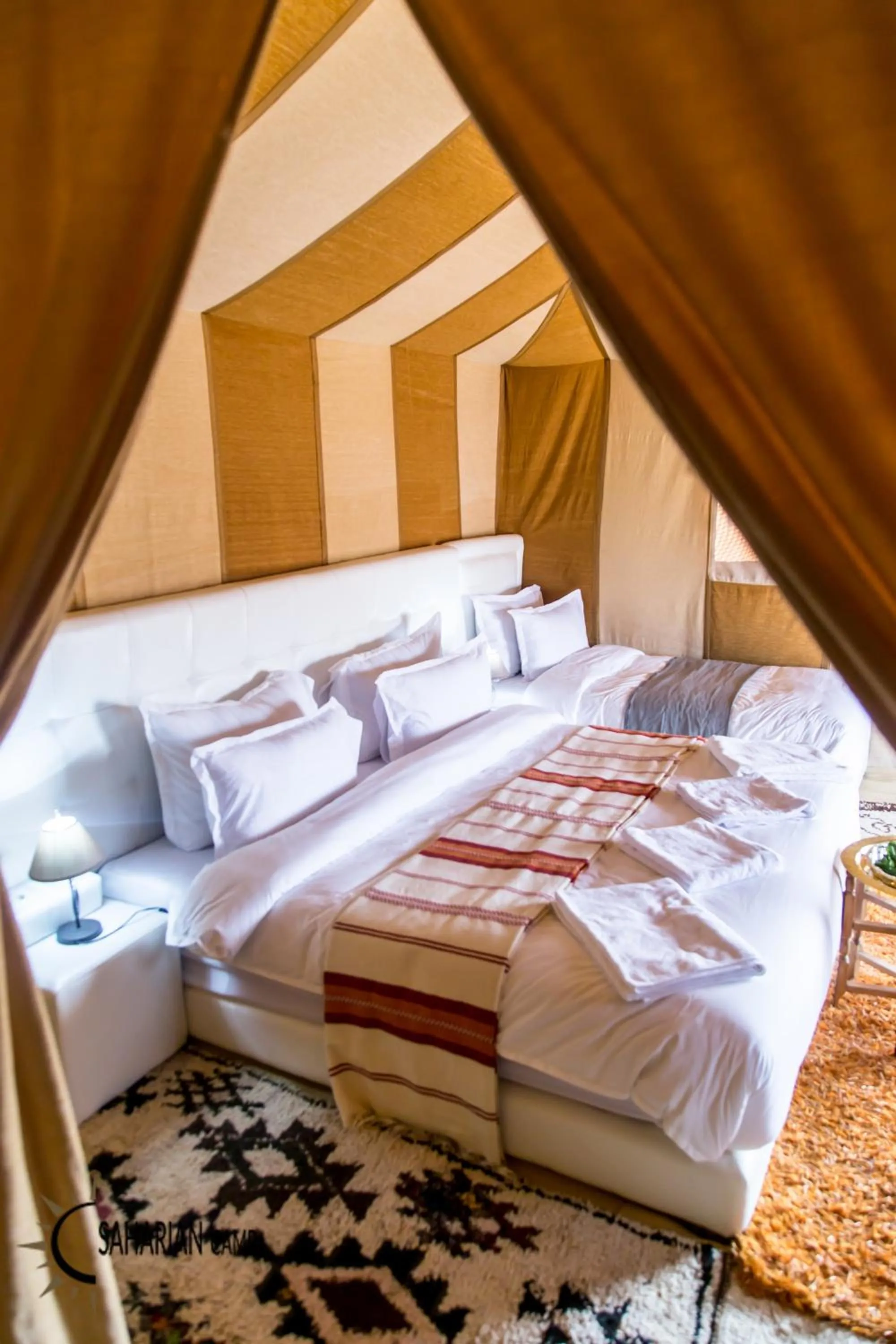 Bed in Merzouga Luxury Camp
