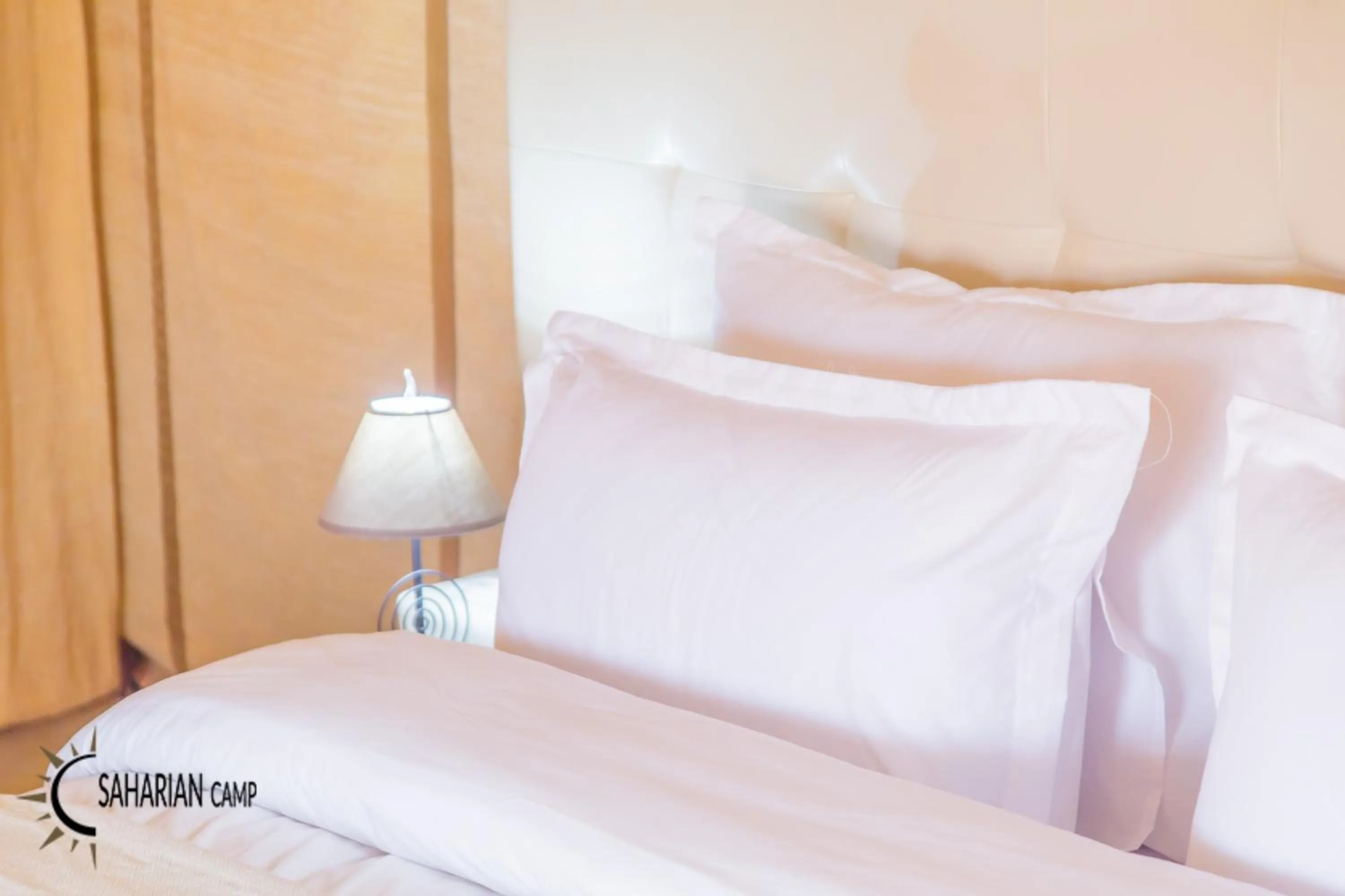 Bed in Merzouga Luxury Camp