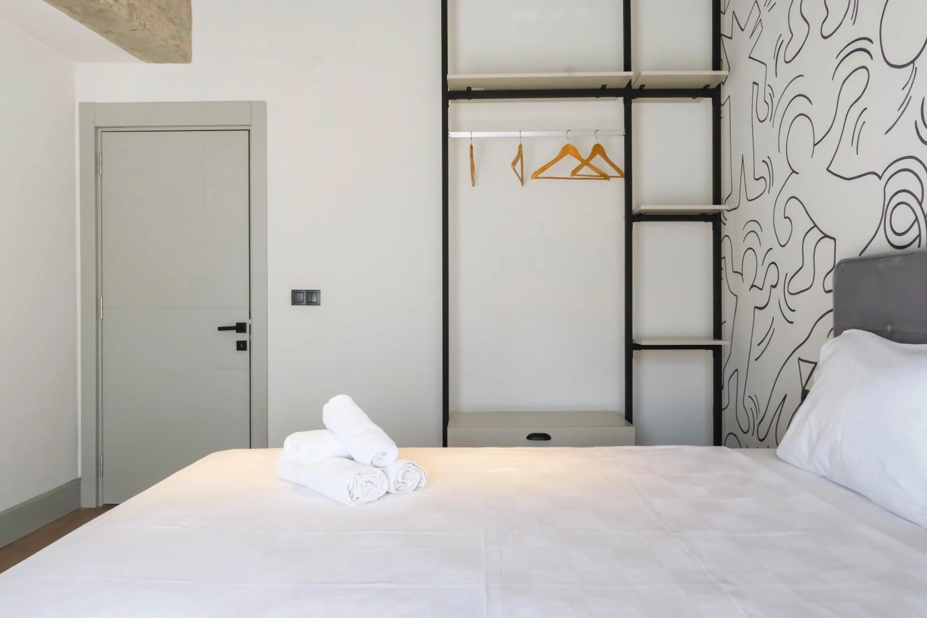 Bed in RudBlu Suites