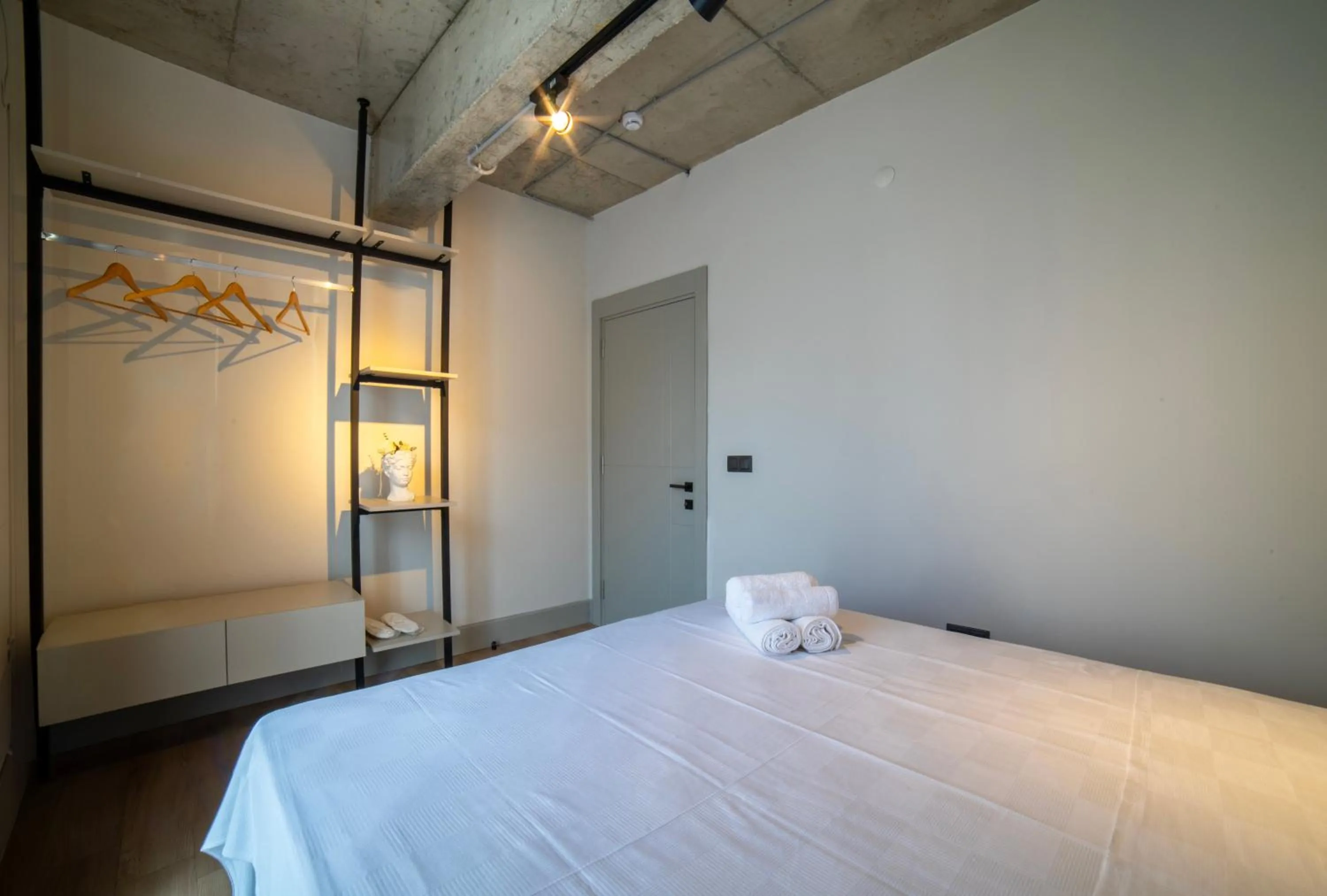 Bed in RudBlu Suites