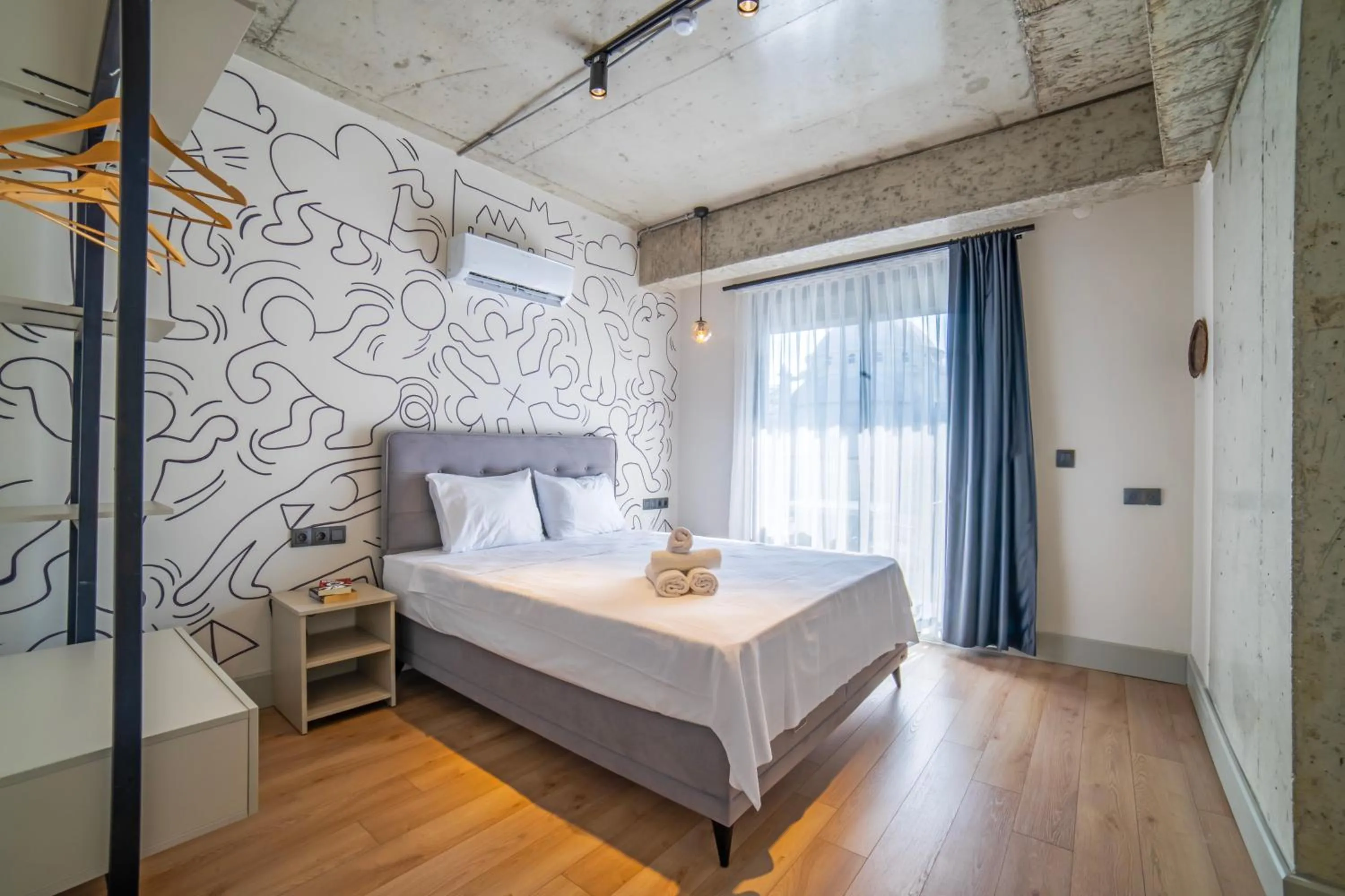 Bed in RudBlu Suites