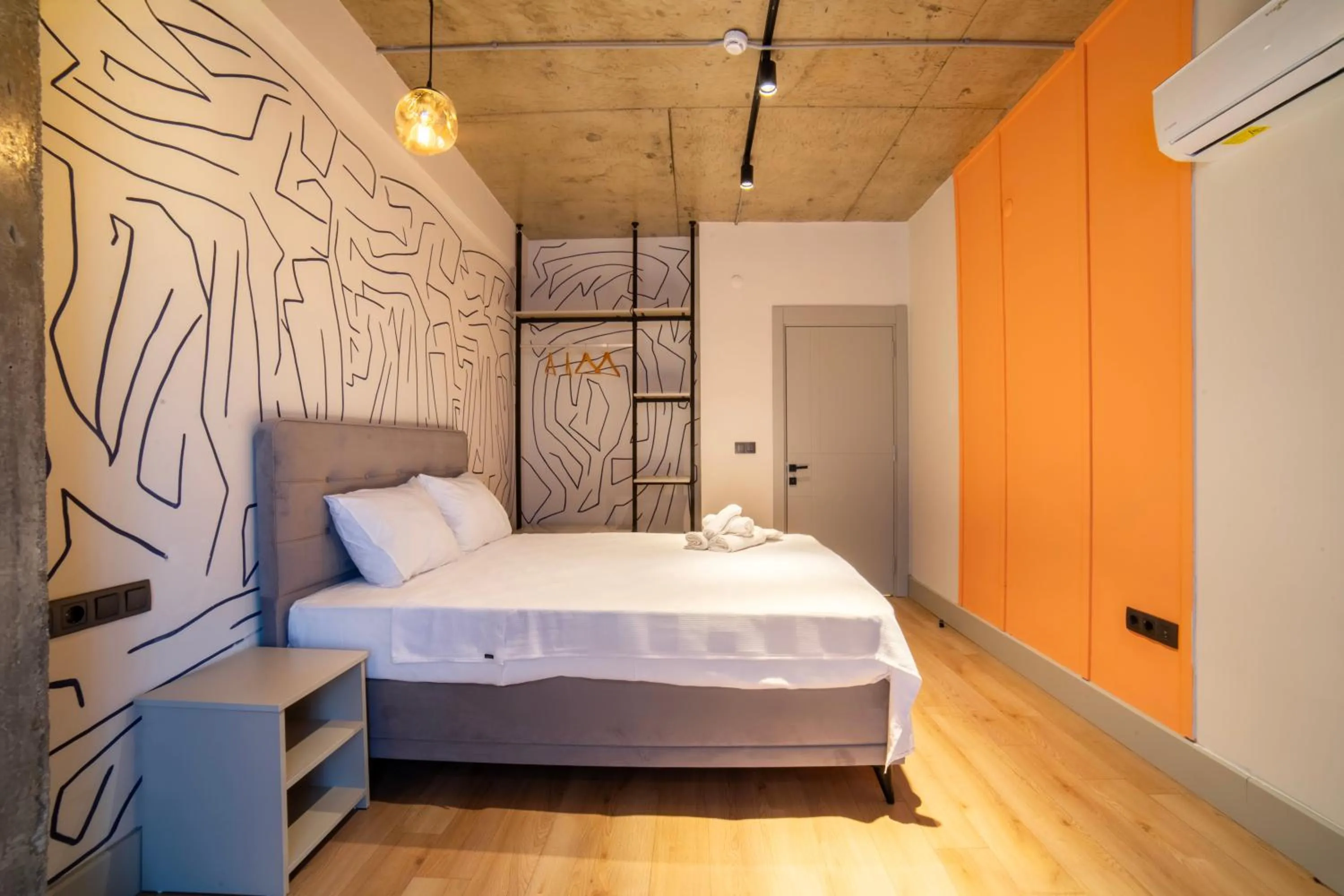 Bed in RudBlu Suites