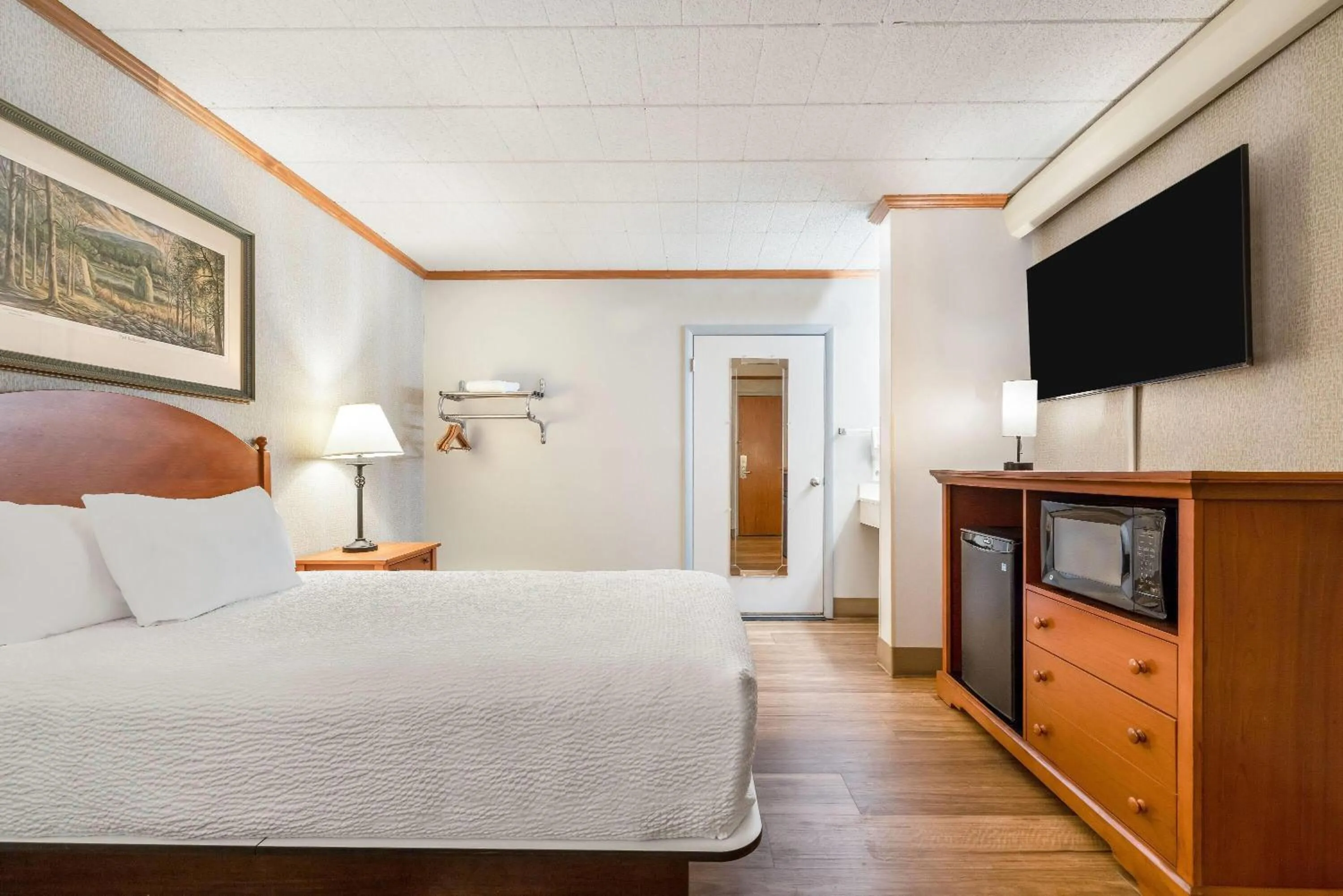 Bed in Ramada by Wyndham State College Hotel & Conference Center