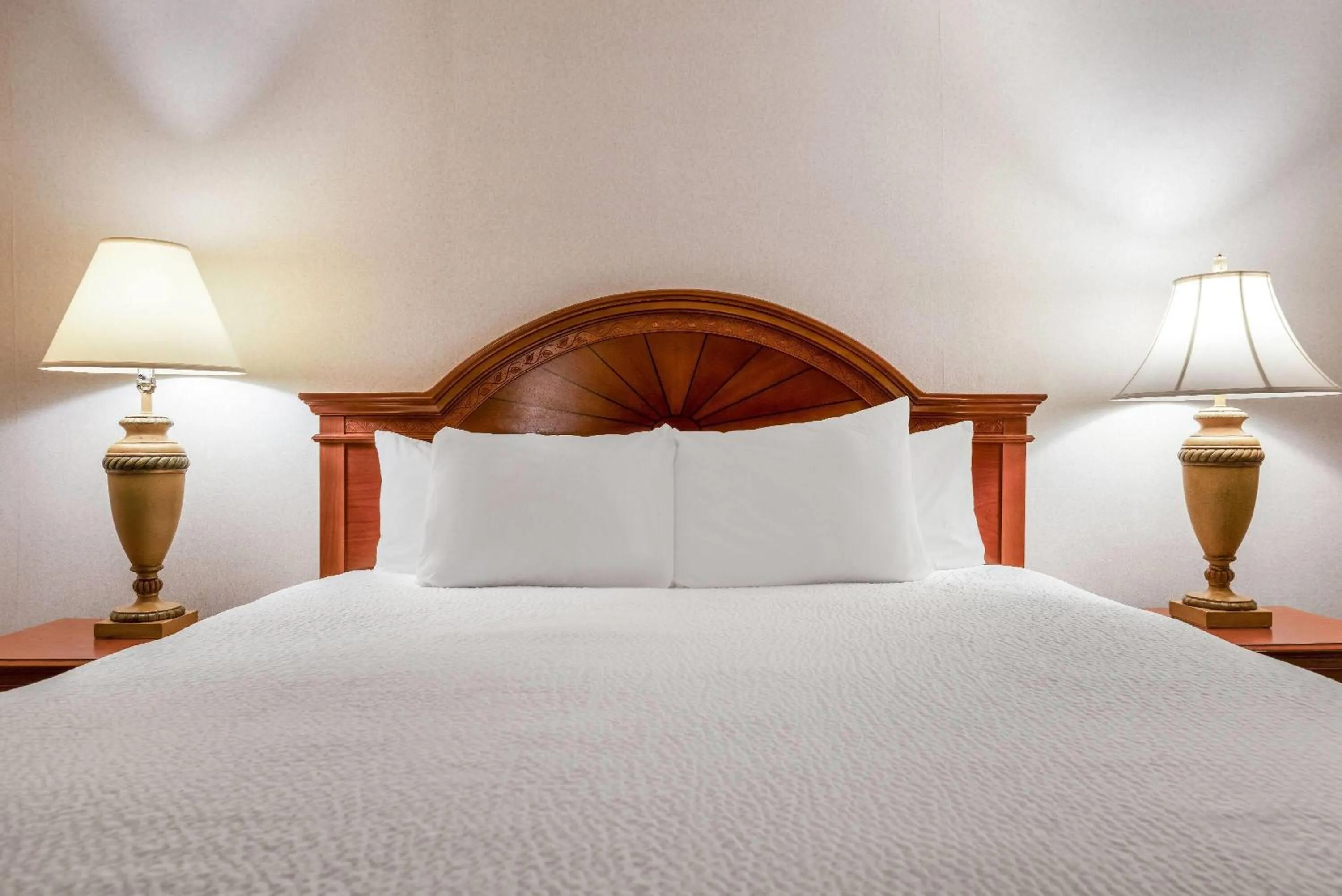 Photo of the whole room, Bed in Ramada by Wyndham State College Hotel & Conference Center