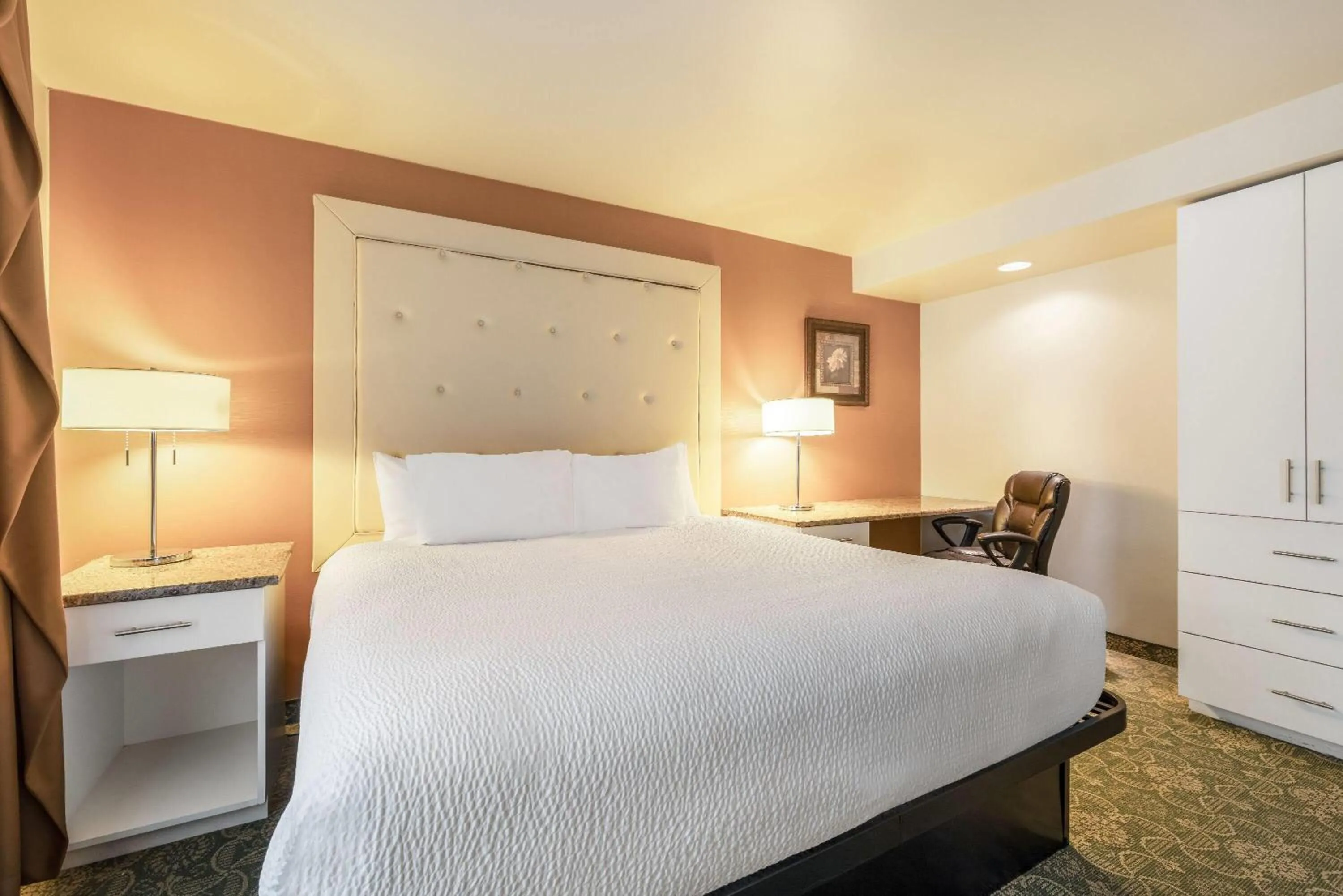 Photo of the whole room, Bed in Ramada by Wyndham State College Hotel & Conference Center