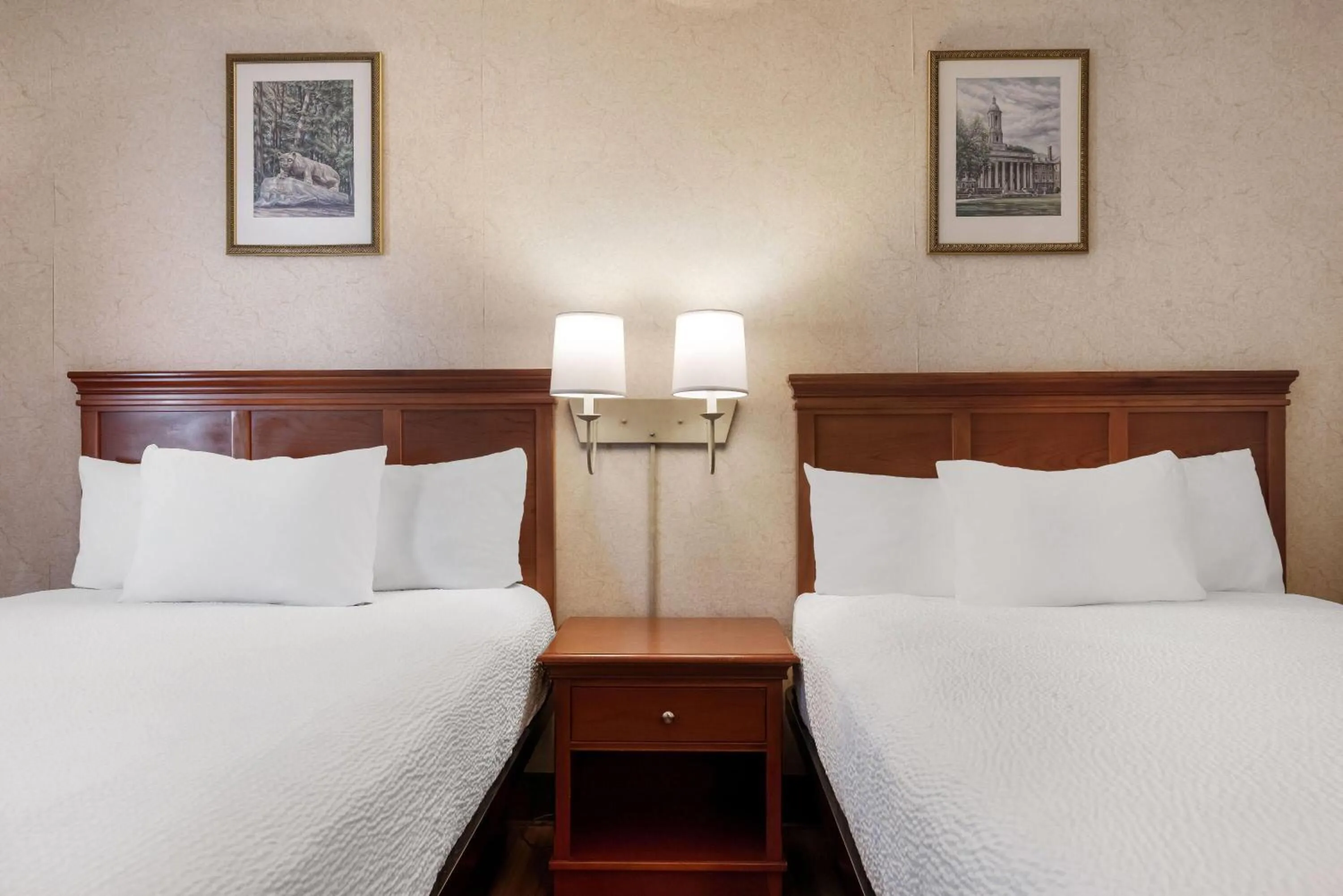 Bed in Ramada by Wyndham State College Hotel & Conference Center