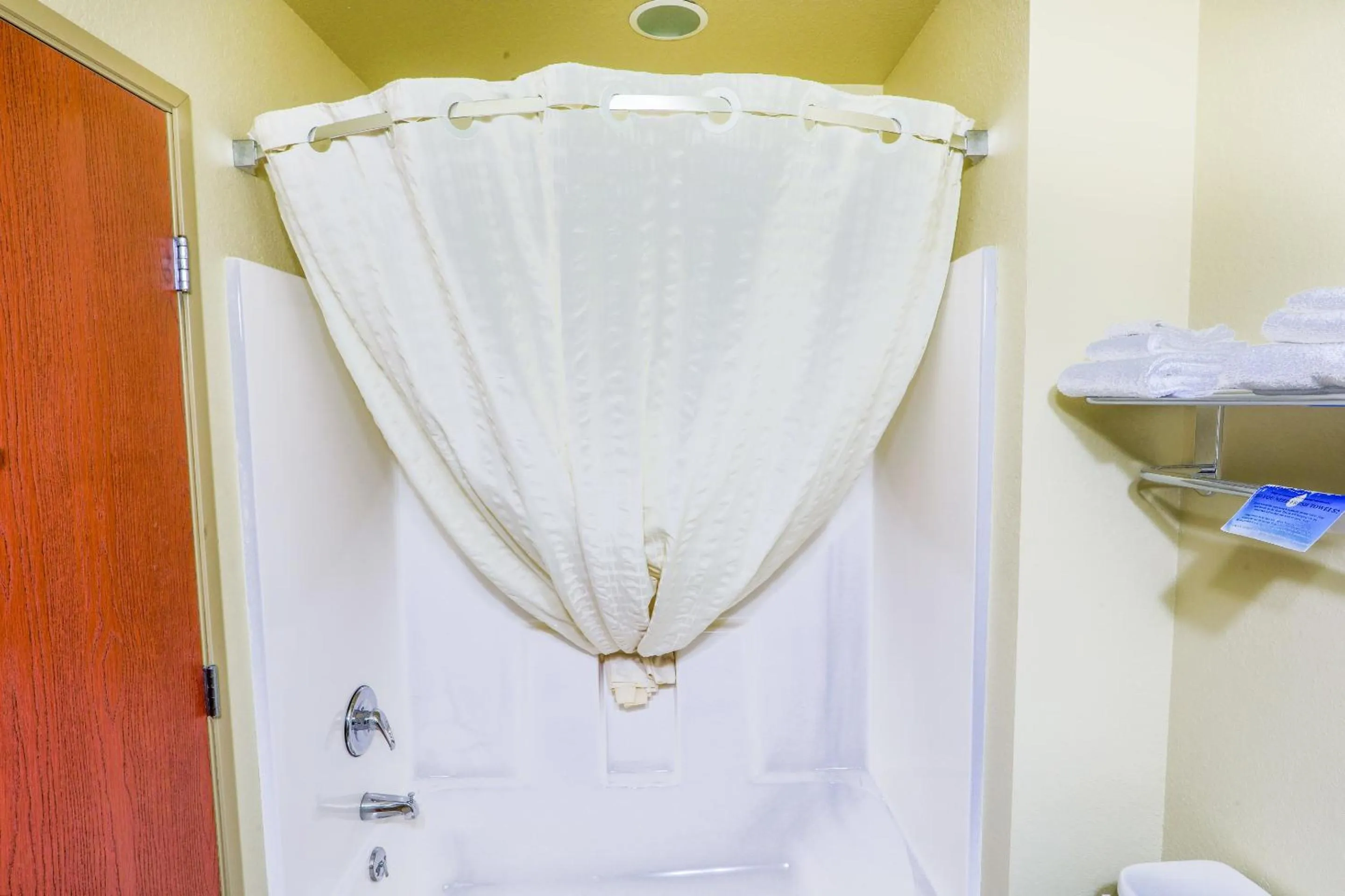 Bathroom in Evansville Inn & Suites by OYO