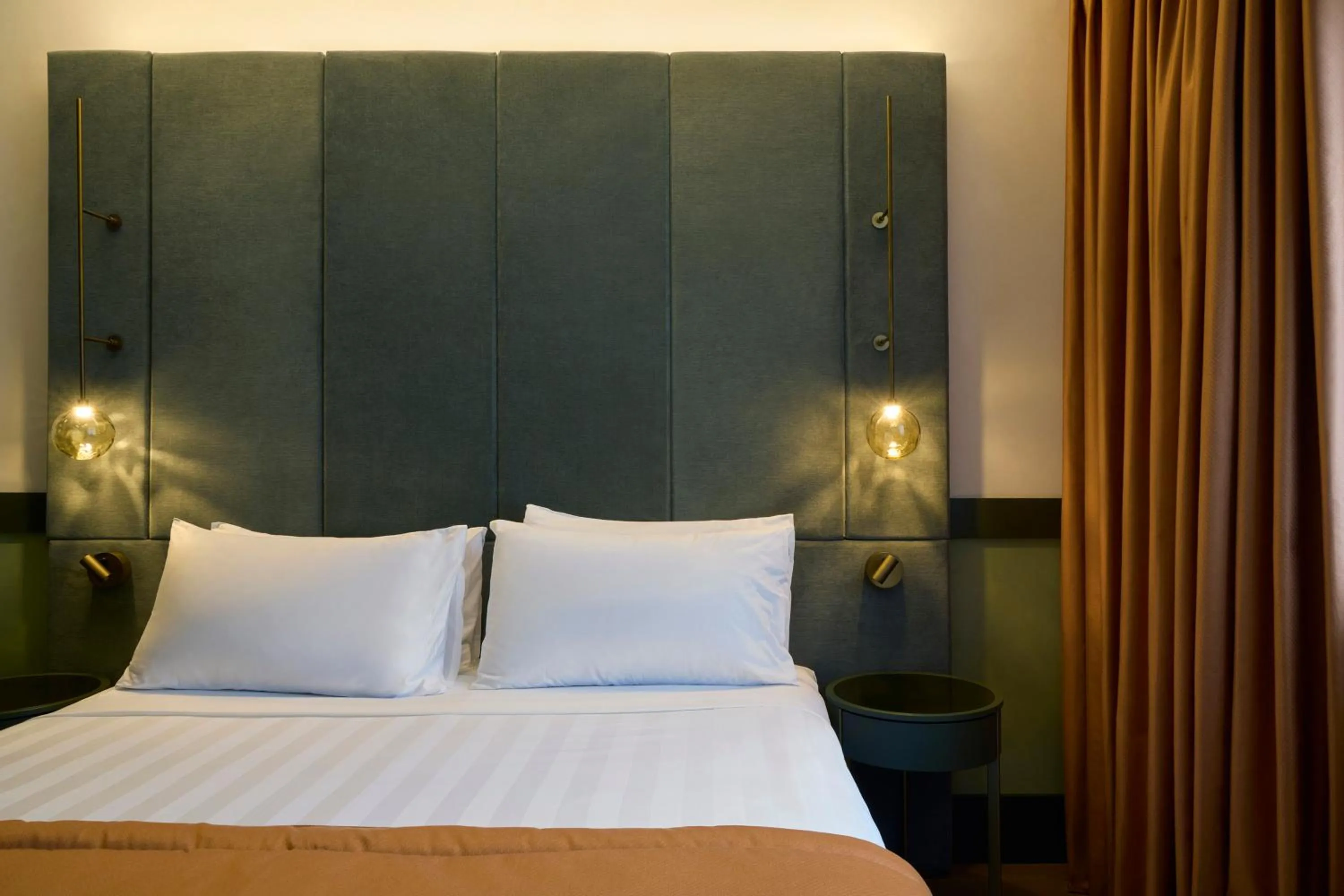 Bed in NEMI Hotel Milano