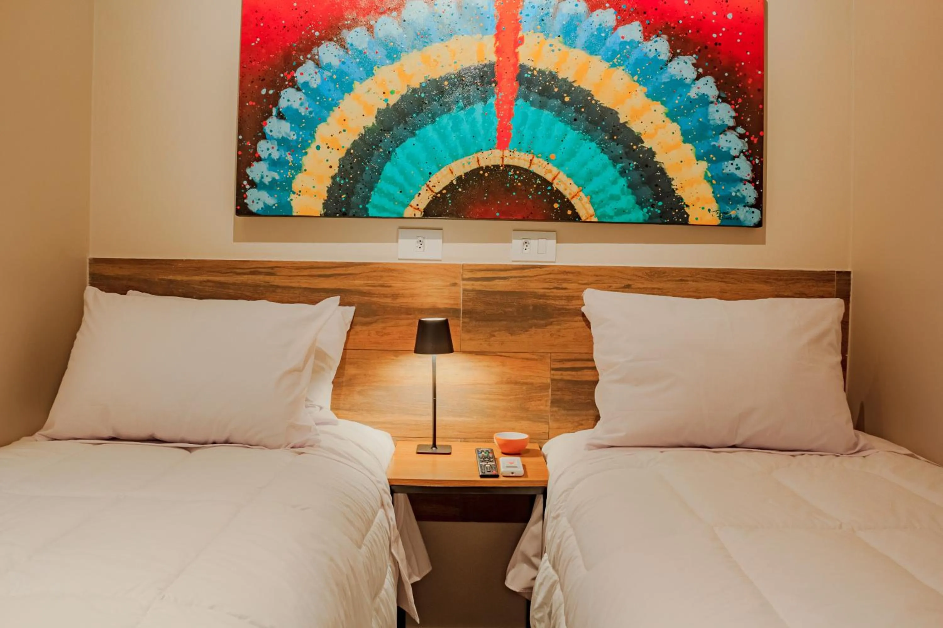 Bed in Che Hermano Suítes