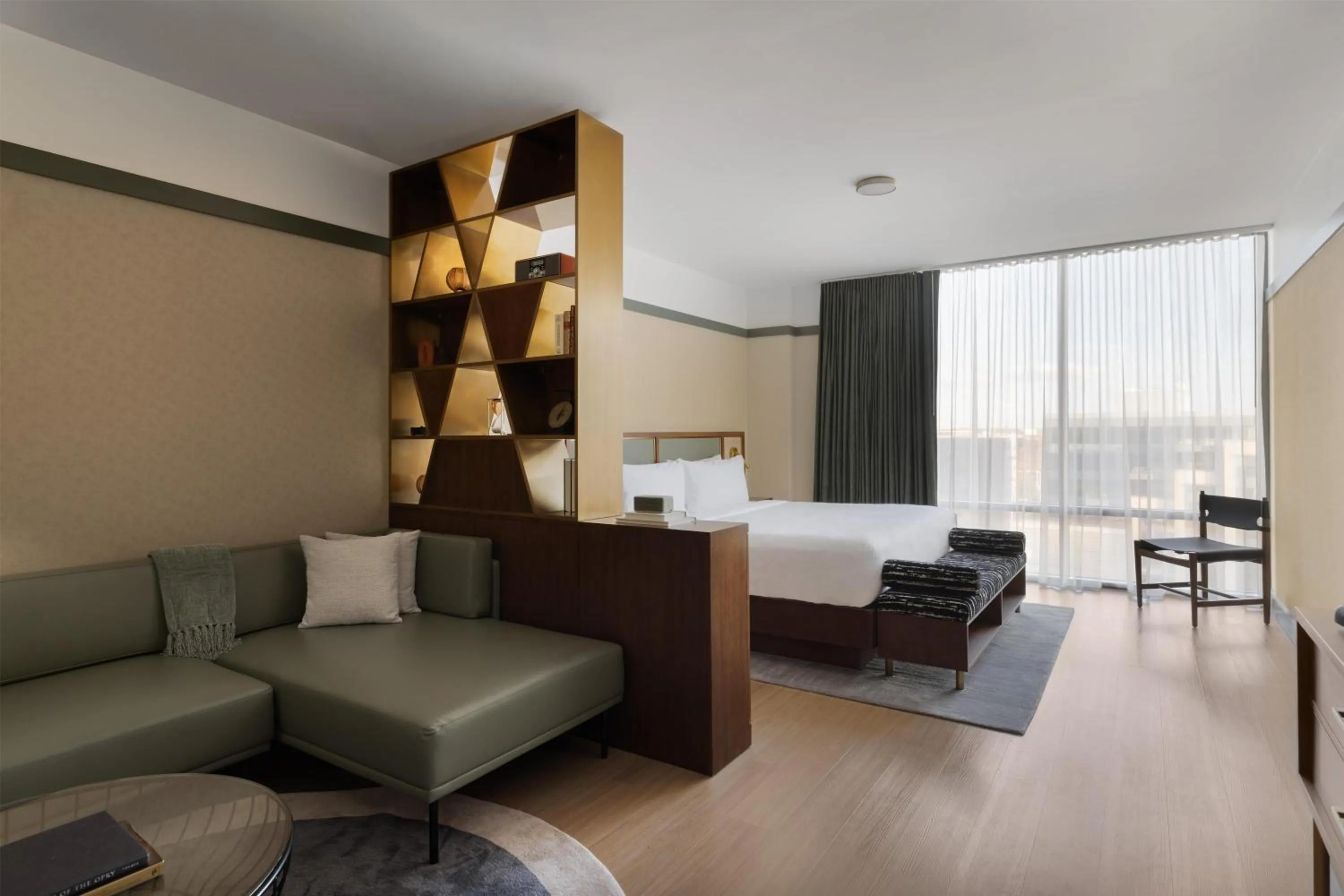 Living room, Bed in The Printing House Hotel, Tapestry Collection By Hilton