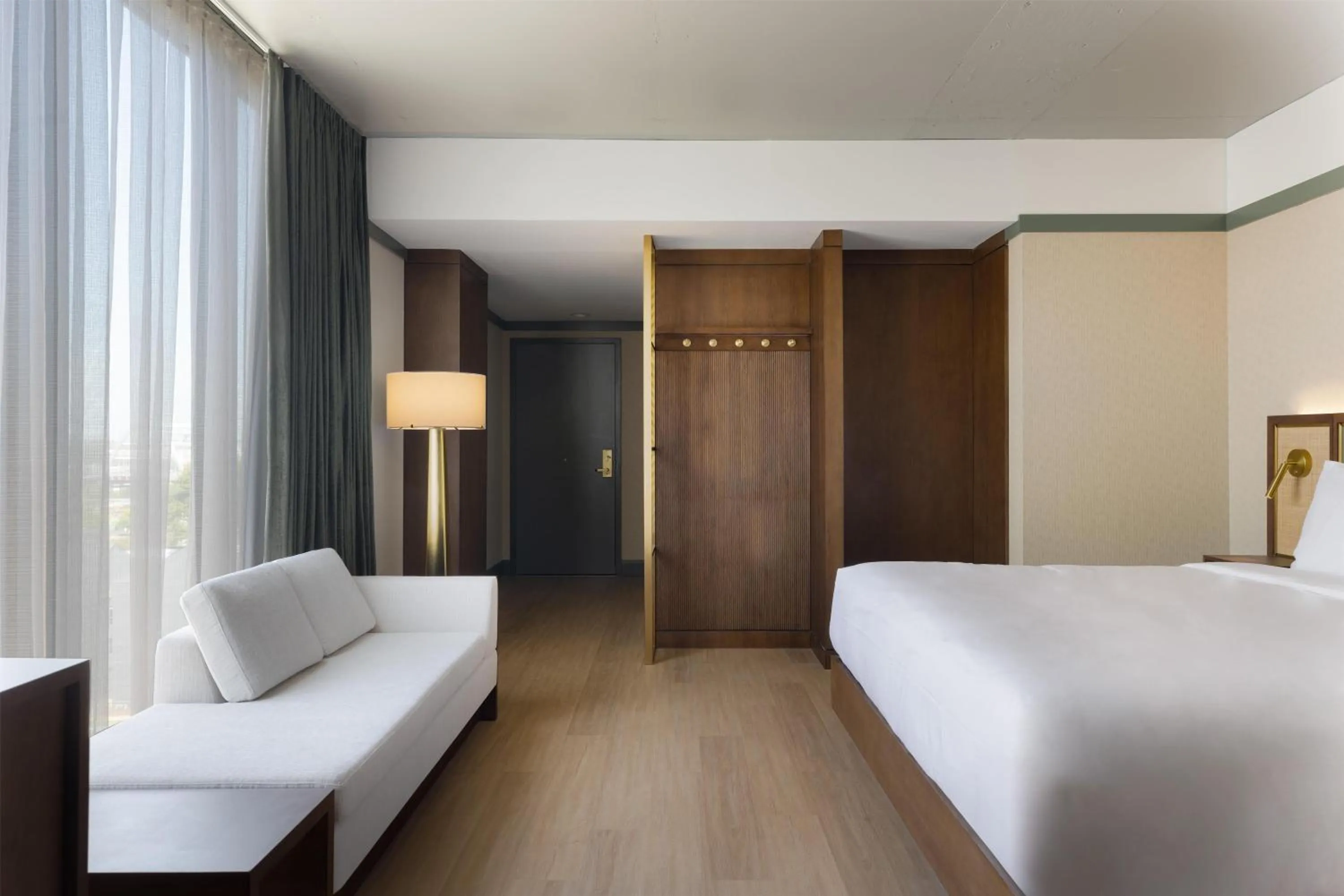 Living room, Bed in The Printing House Hotel, Tapestry Collection By Hilton