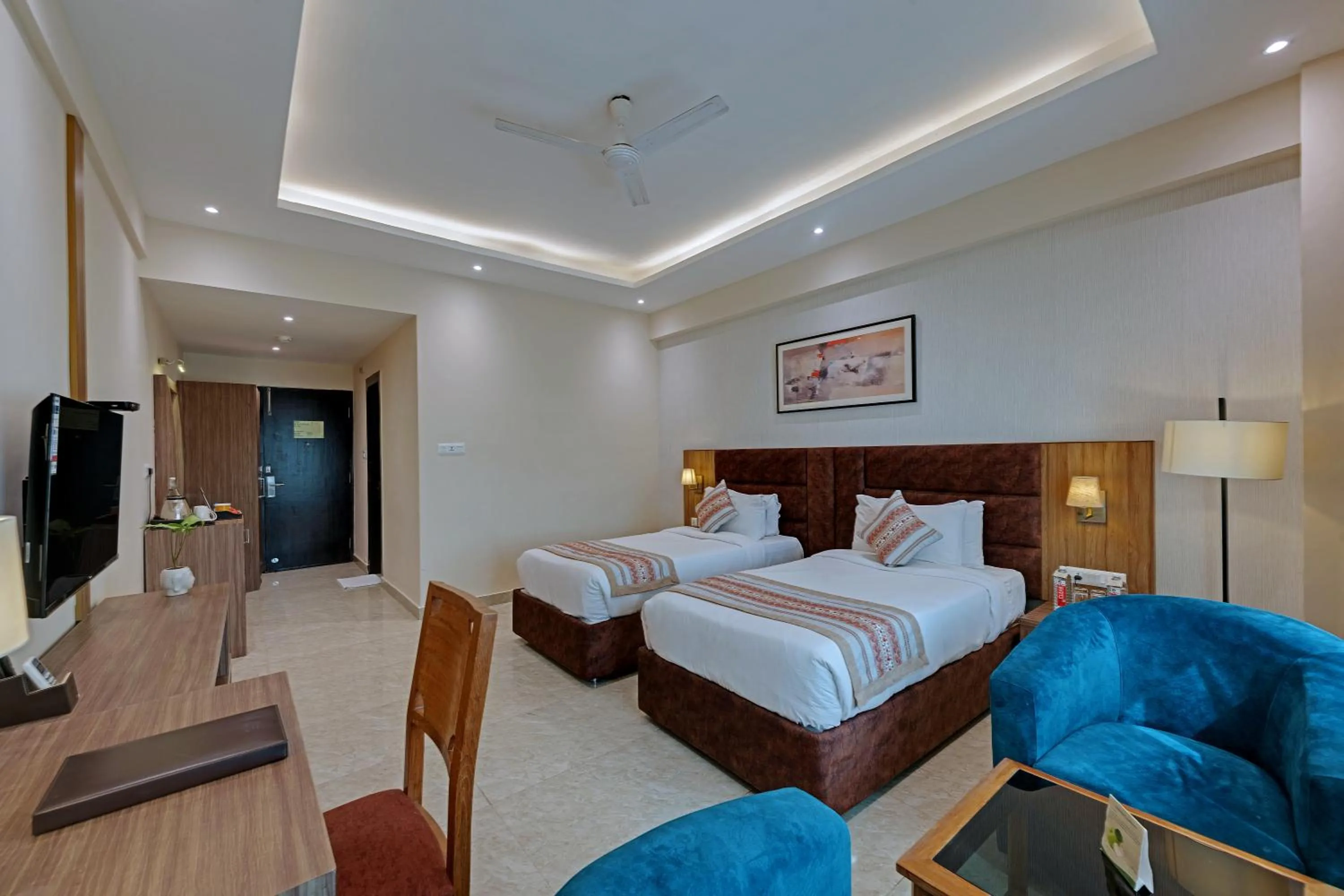 Seating area, Bed in The Fern Residency, Bodhgaya, Series by Marriott