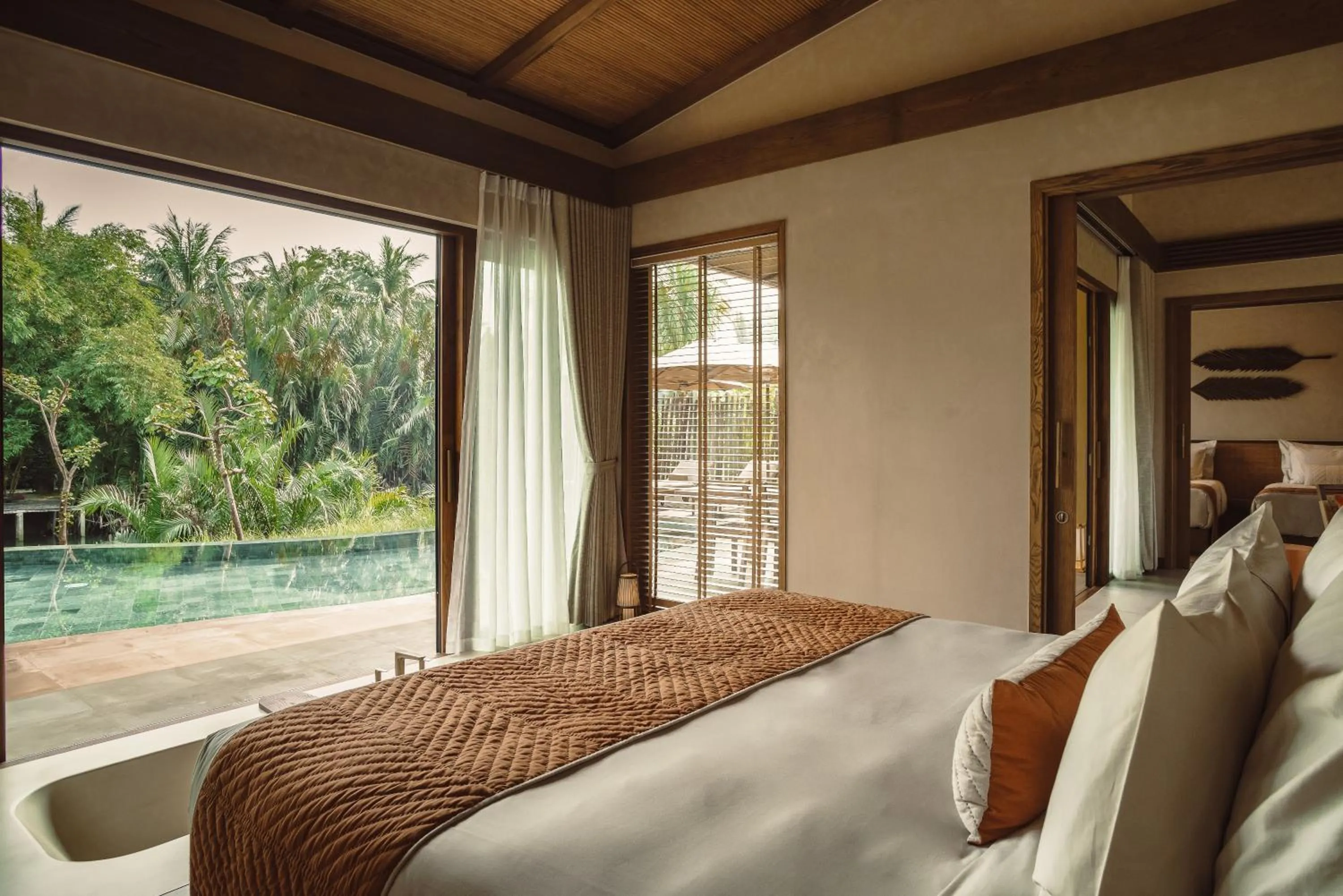 Bed in Namia River Retreat - Wellness Inclusive Resort