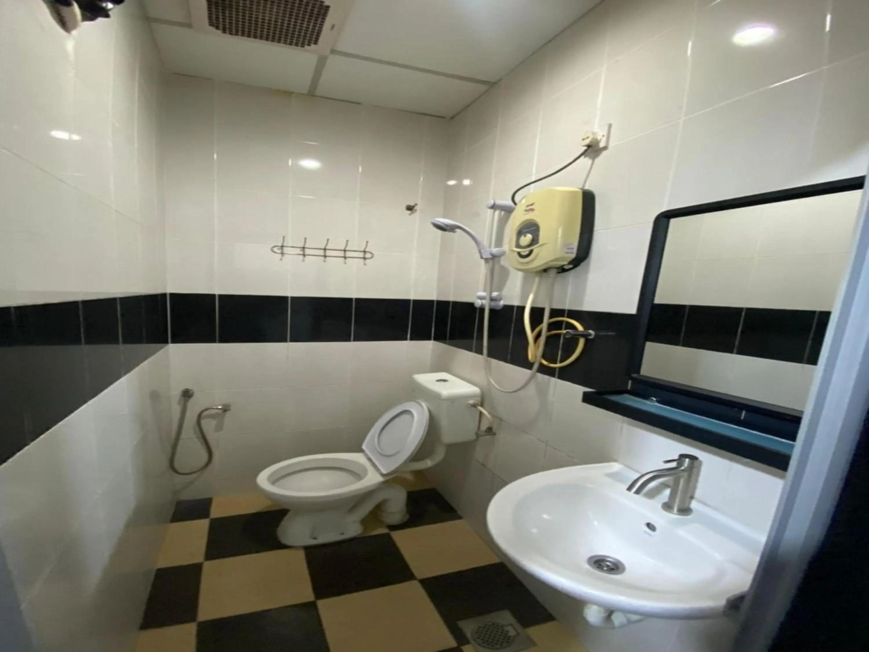 Bathroom in Hotel O Captain Hotel Cafe & Bistro