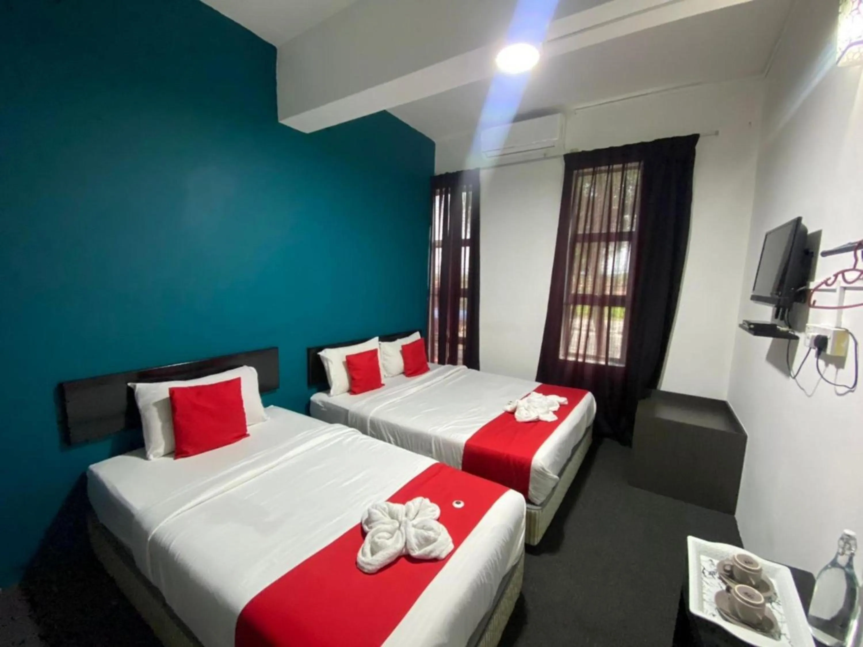 Bedroom in Hotel O Captain Hotel Cafe & Bistro