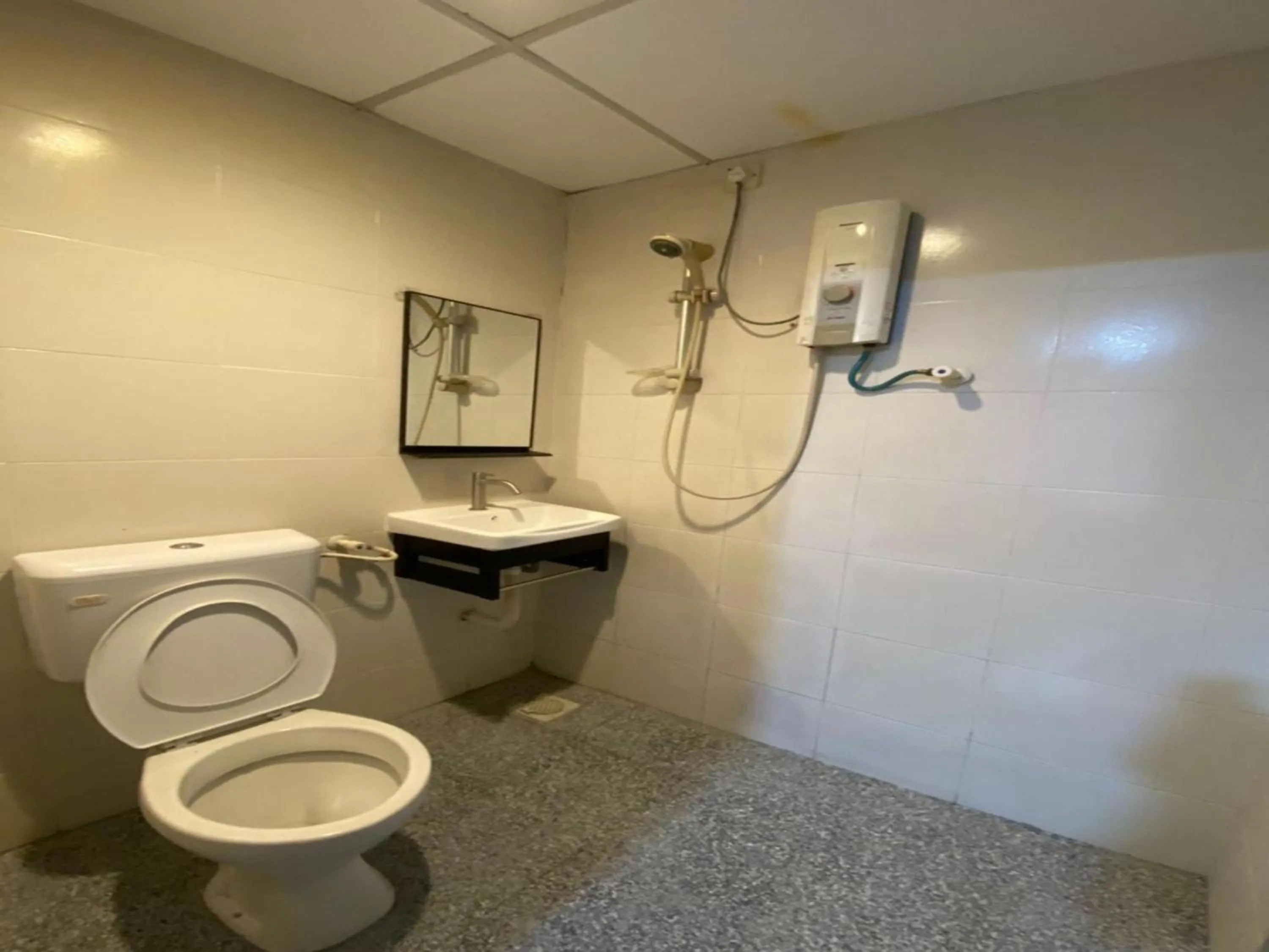 Bathroom in Hotel O Captain Hotel Cafe & Bistro