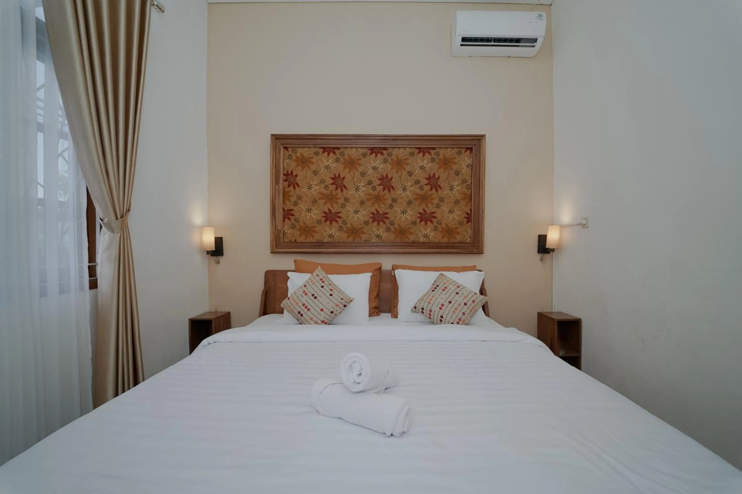 Bed in Villa D'Maguwo Suites