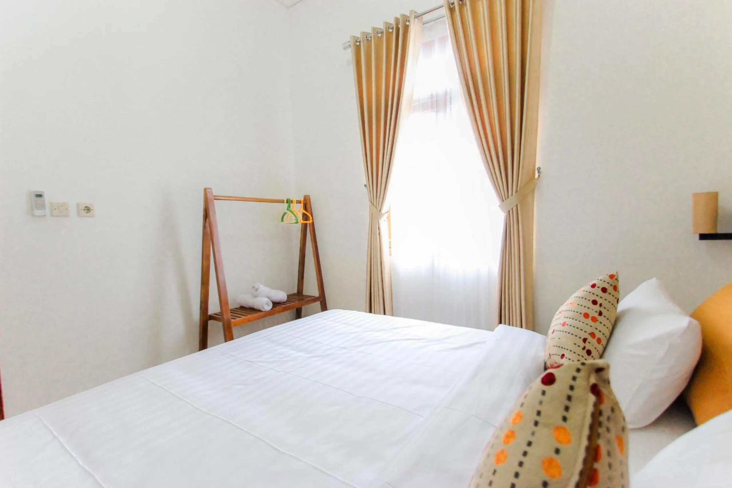 Bed in Villa D'Maguwo Suites