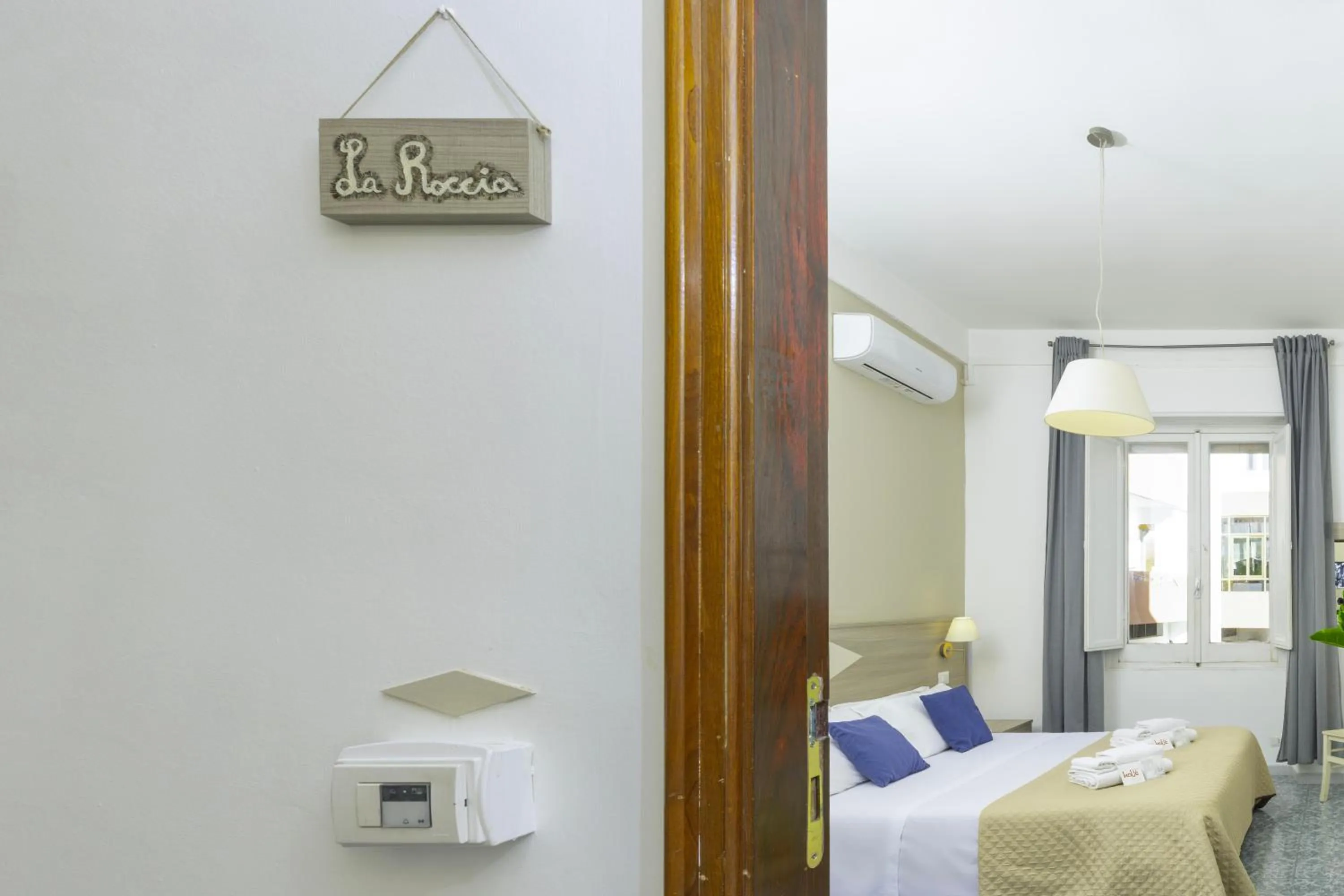 Bed in Kaliè Rooms Guest House