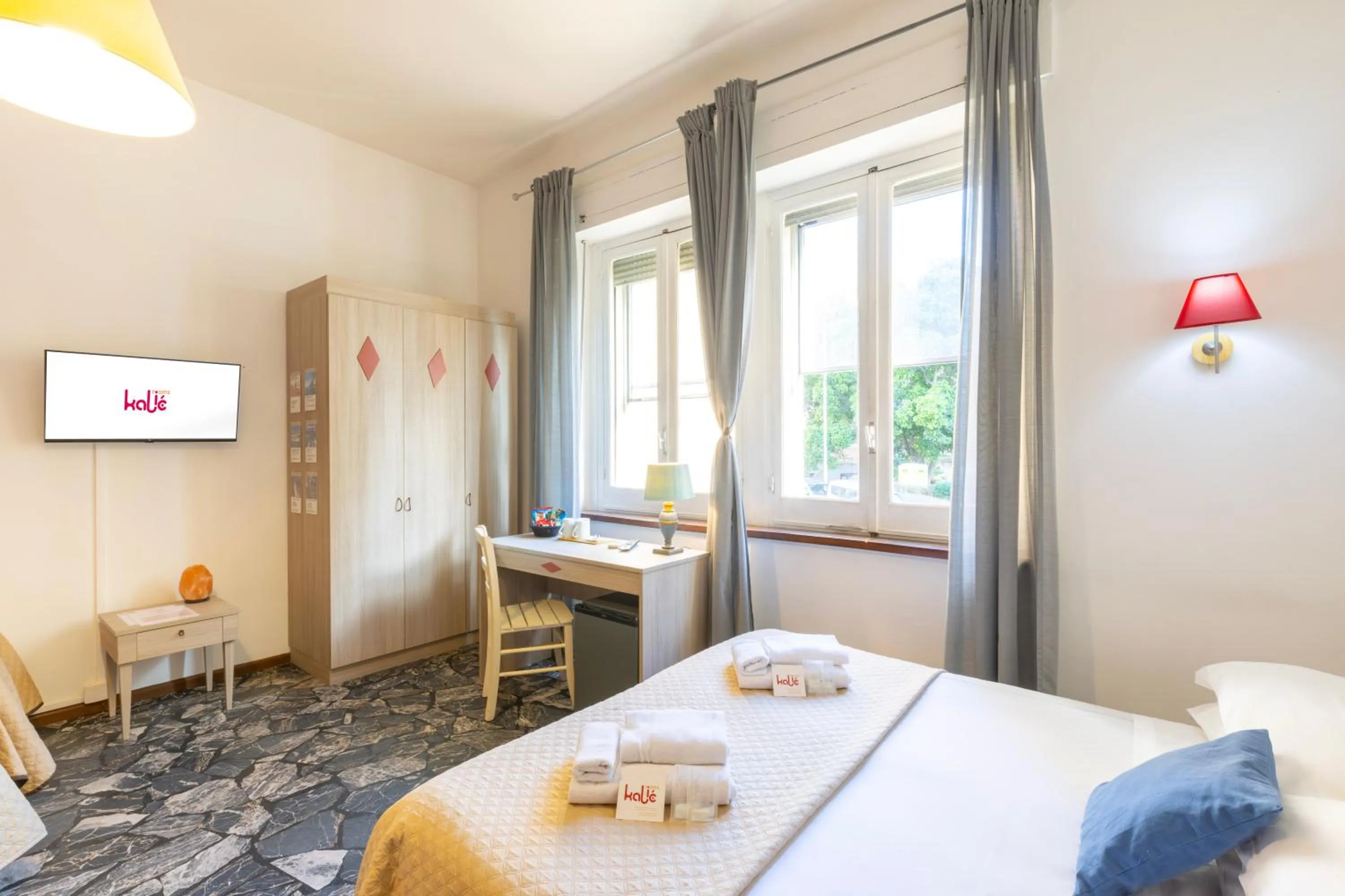 Bed in Kaliè Rooms Guest House