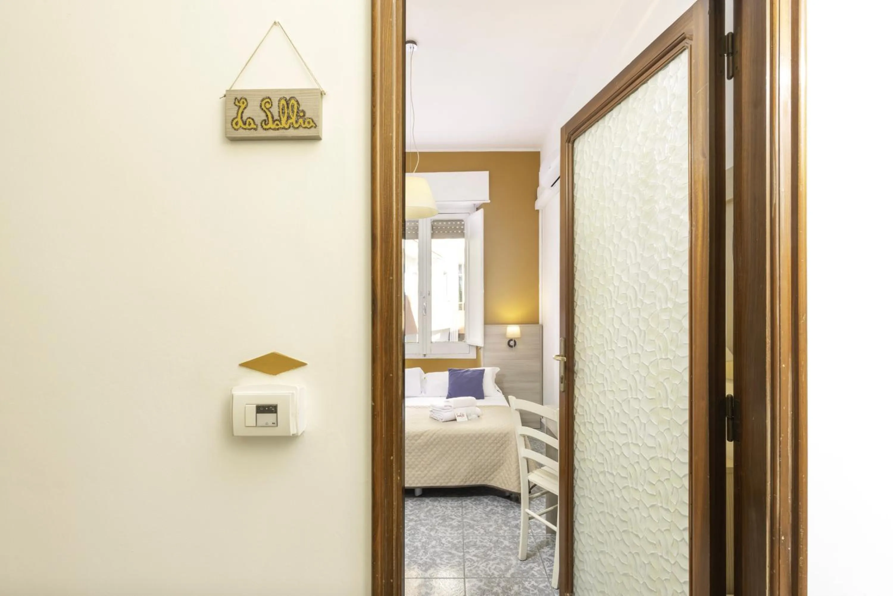 Bed in Kaliè Rooms Guest House