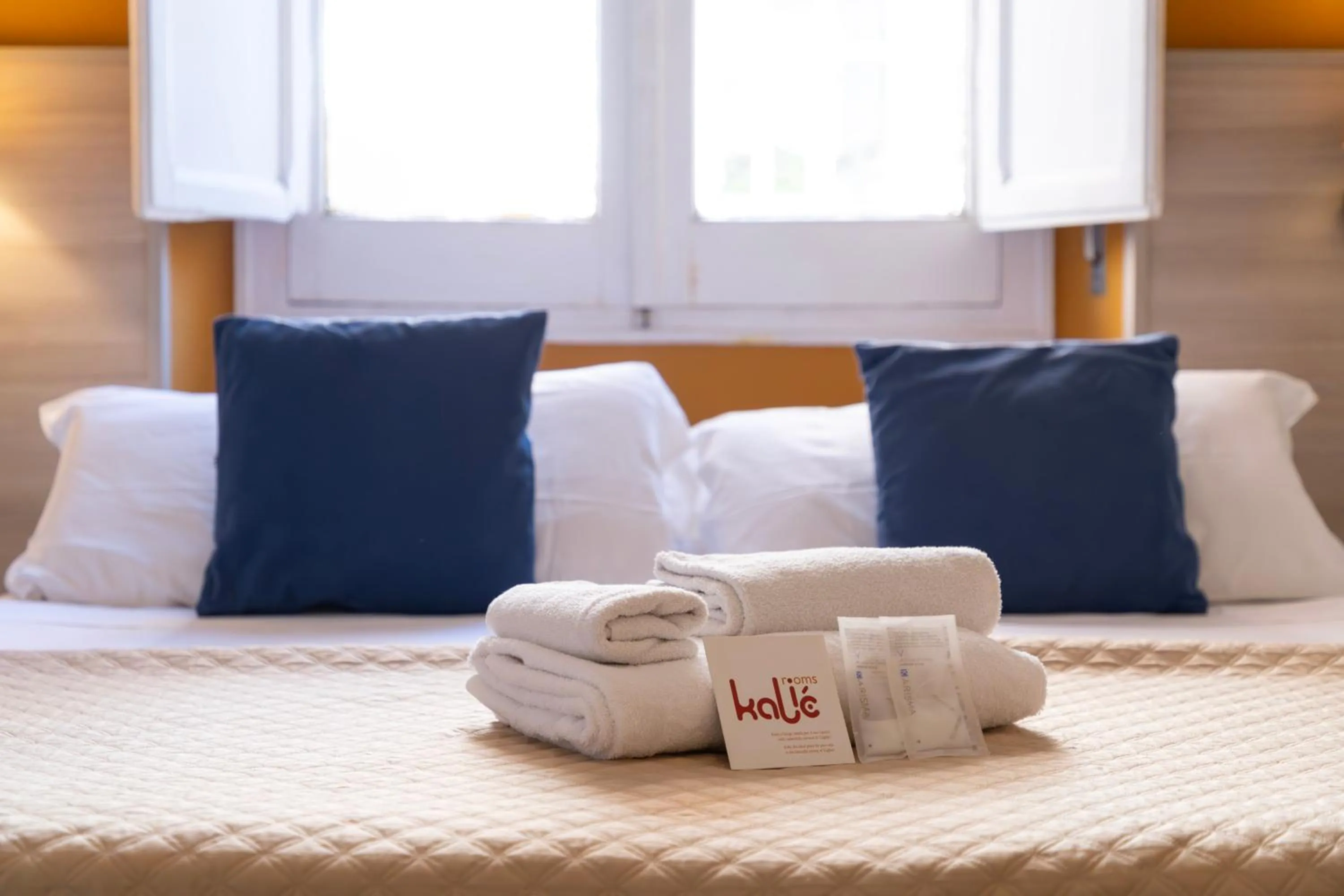 Bed in Kaliè Rooms Guest House