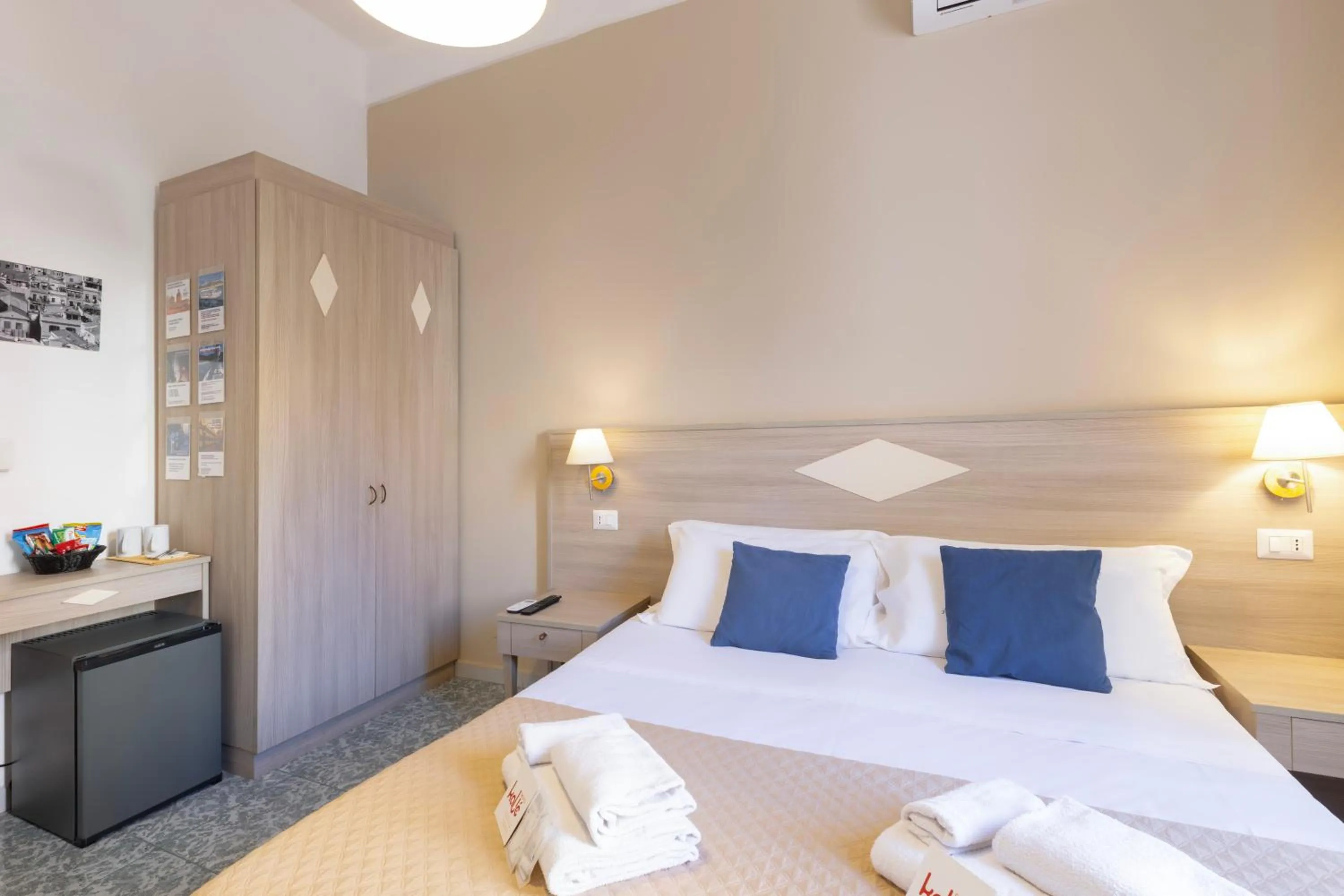 Bed in Kaliè Rooms Guest House