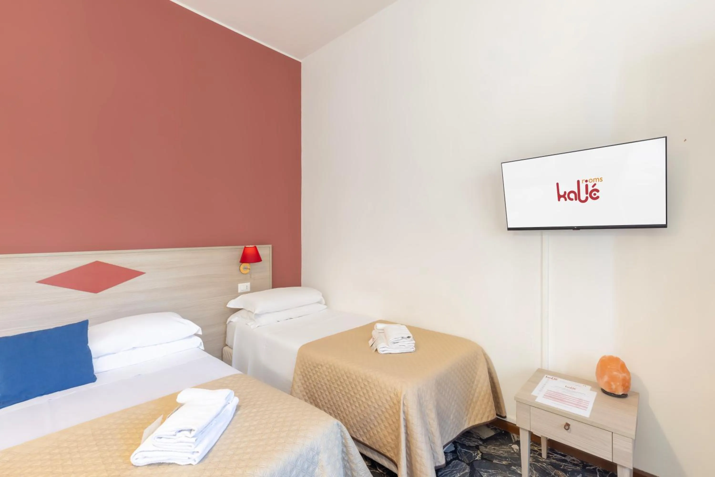 Bed in Kaliè Rooms Guest House