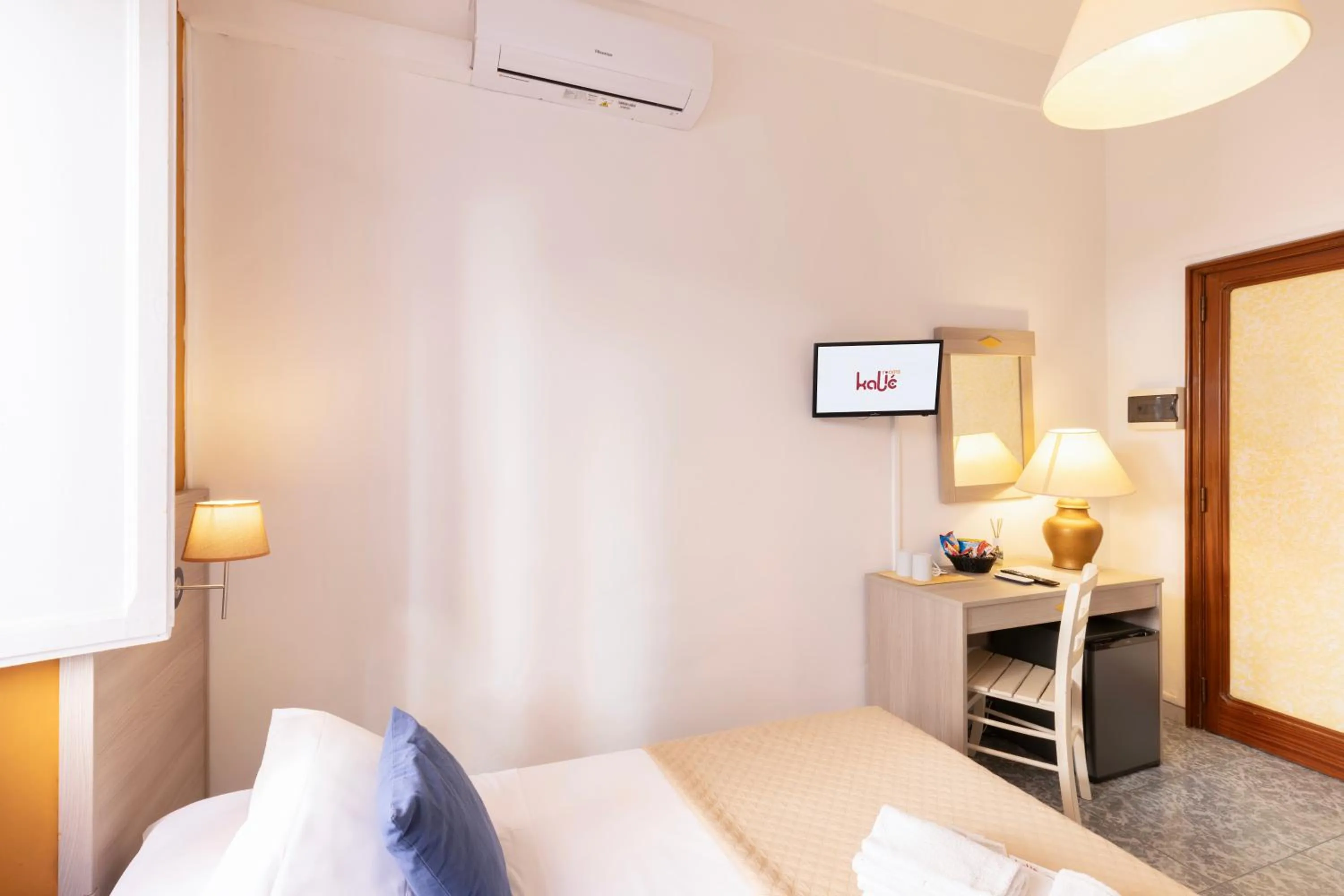 Bed in Kaliè Rooms Guest House