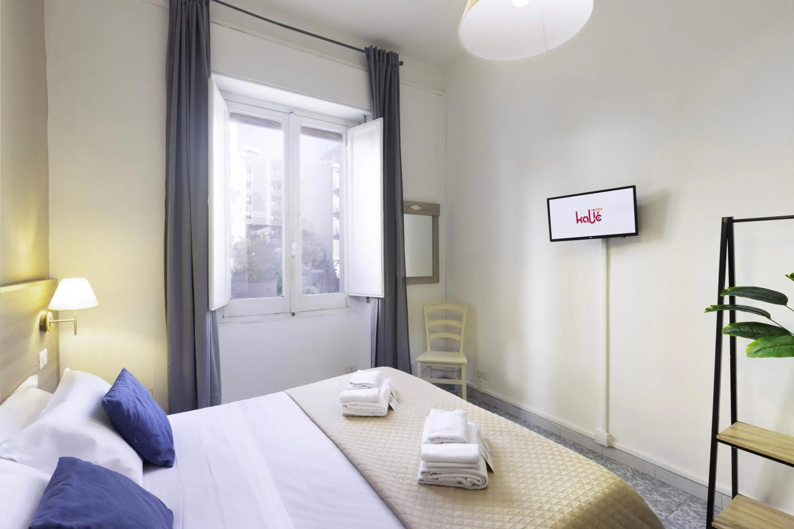 Bed in Kaliè Rooms Guest House