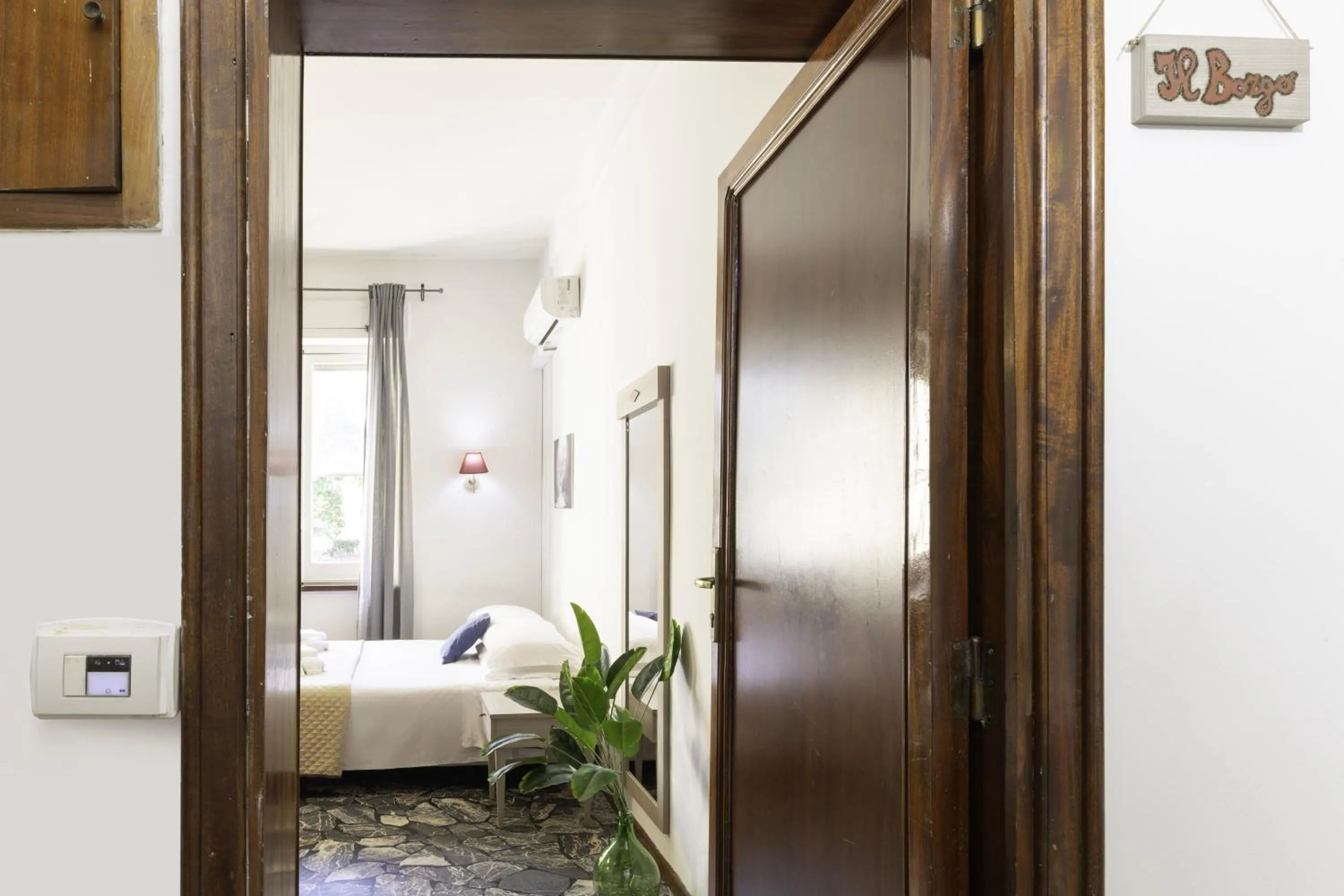 Bed in Kaliè Rooms Guest House