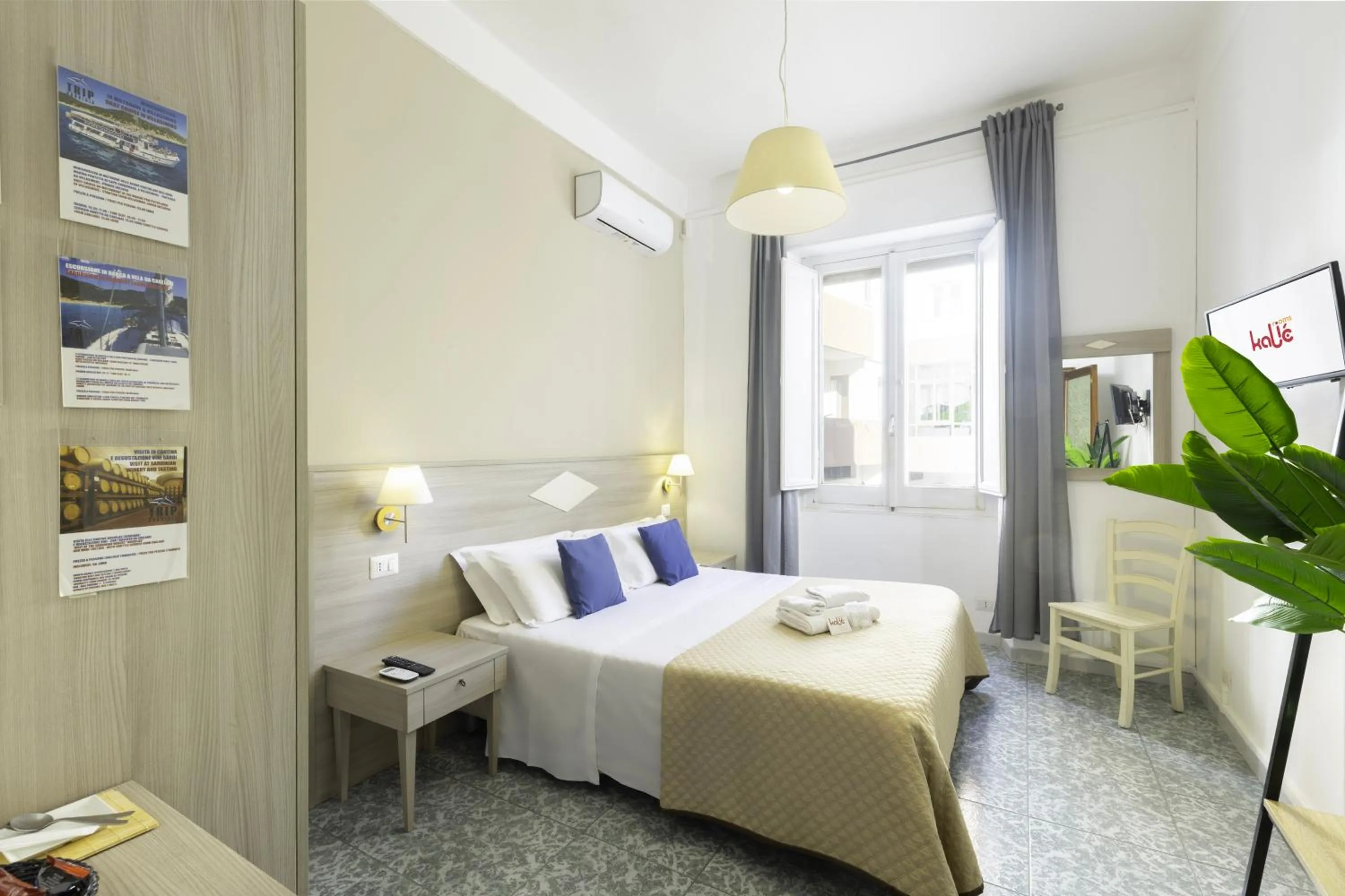 Bed in Kaliè Rooms Guest House