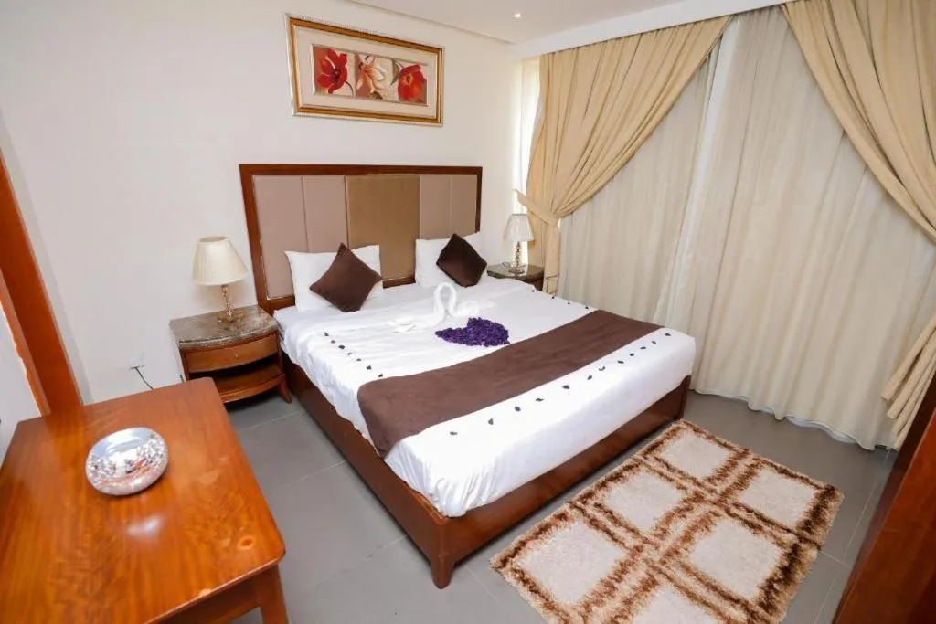 Bed in ماجيك سويت ابوحليفة Magic Suite Abu Halifa