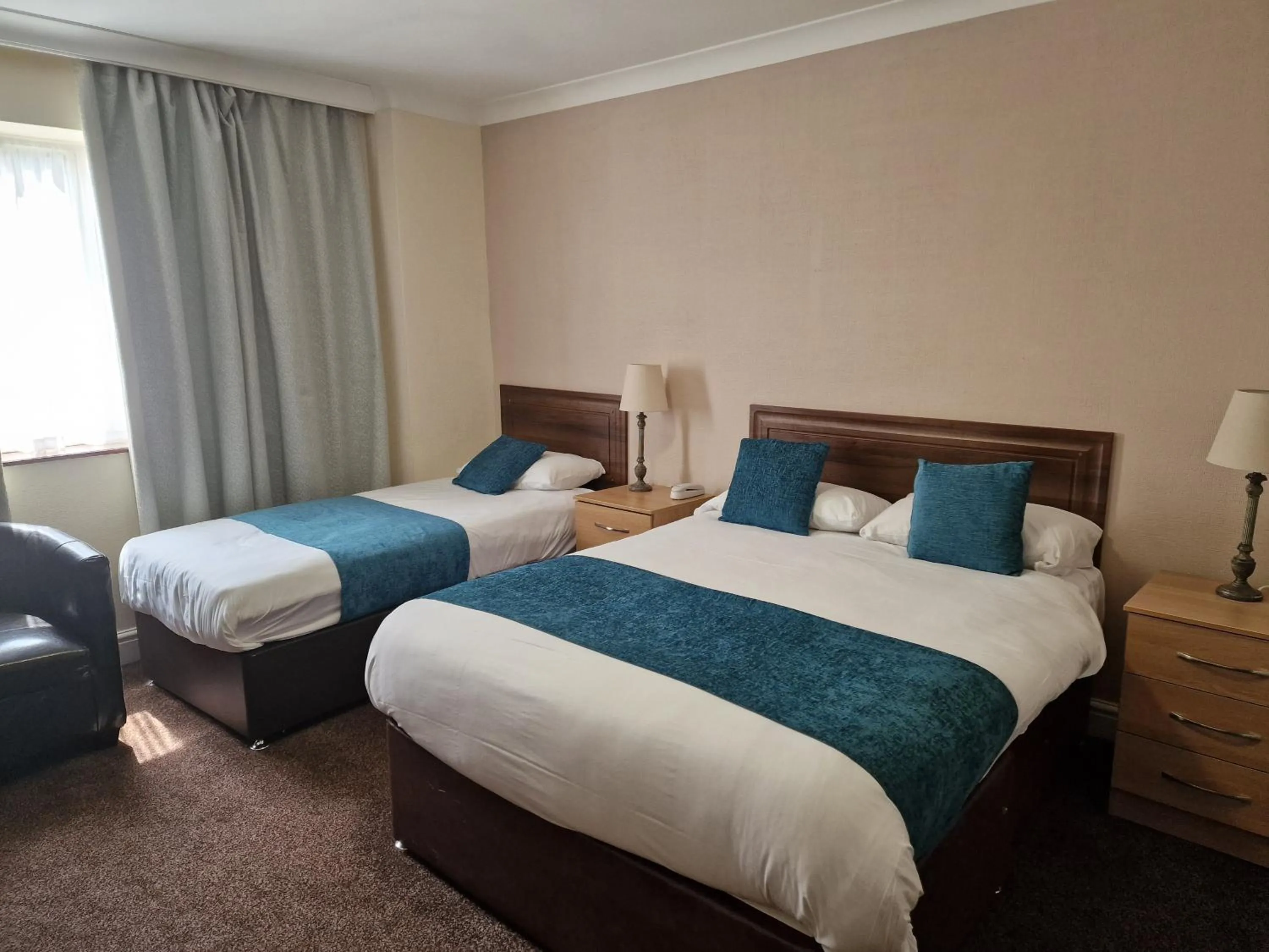 Bed in Royal Court Hotel