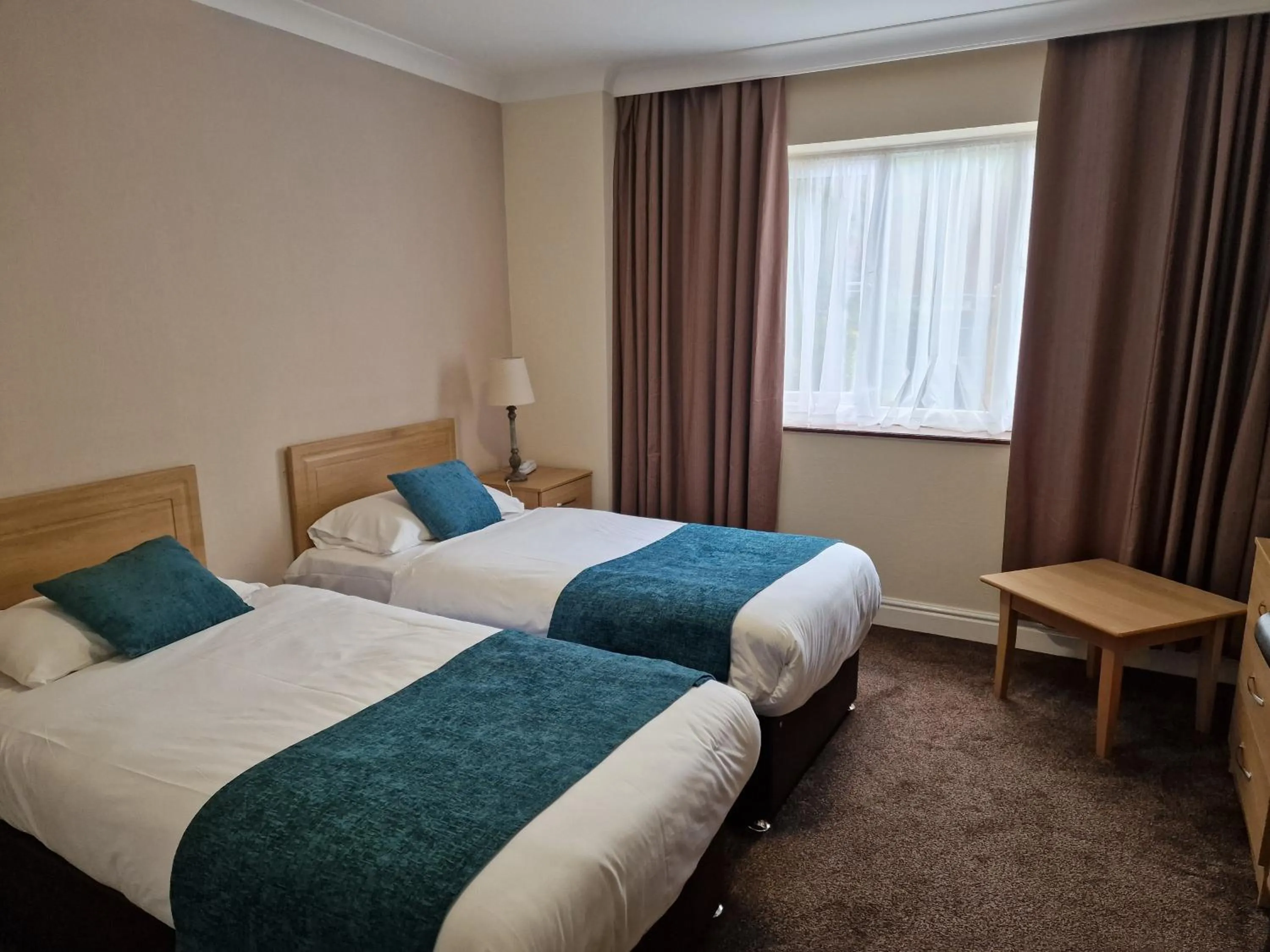 Bed in Royal Court Hotel