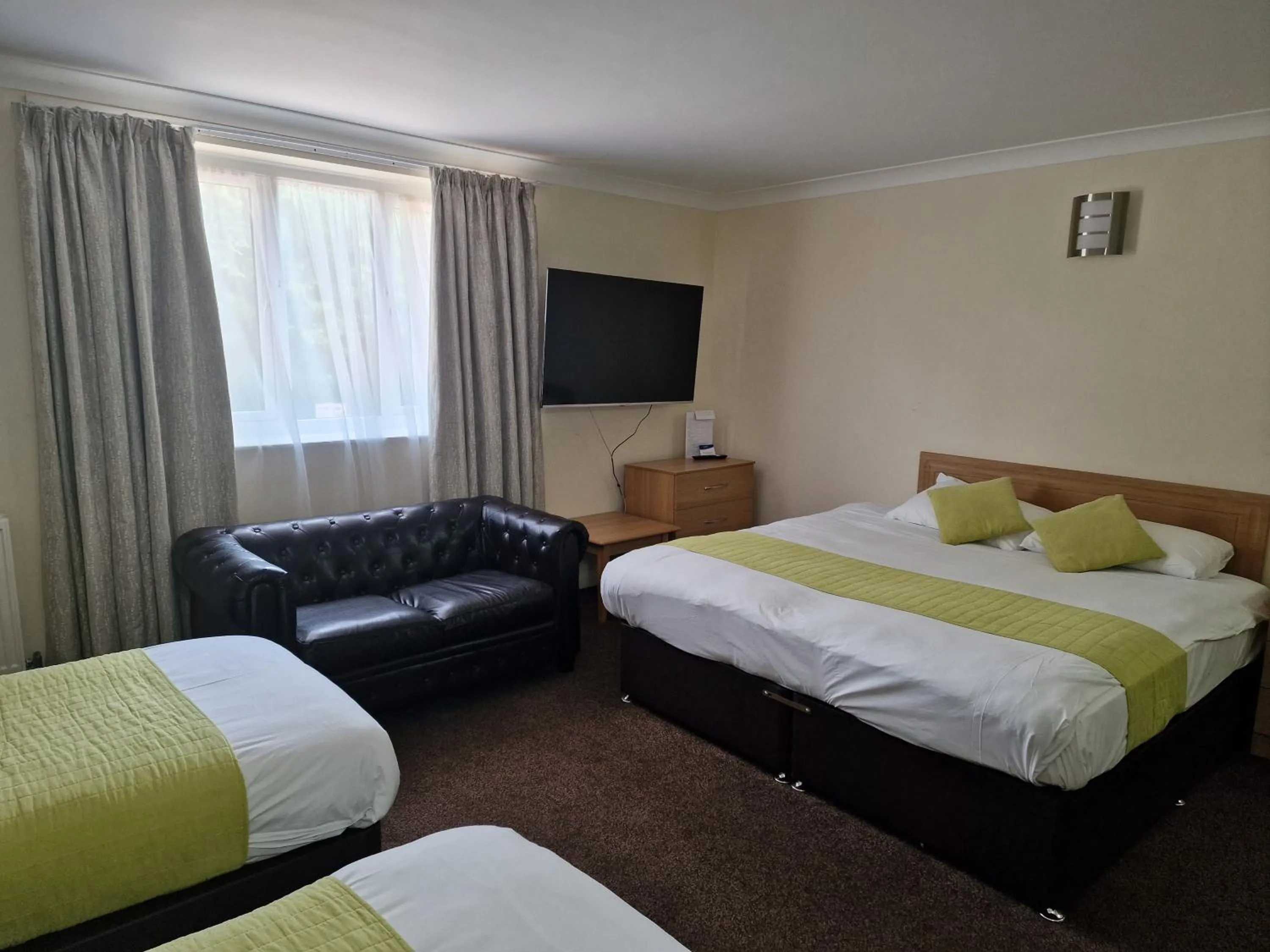 Bed in Royal Court Hotel