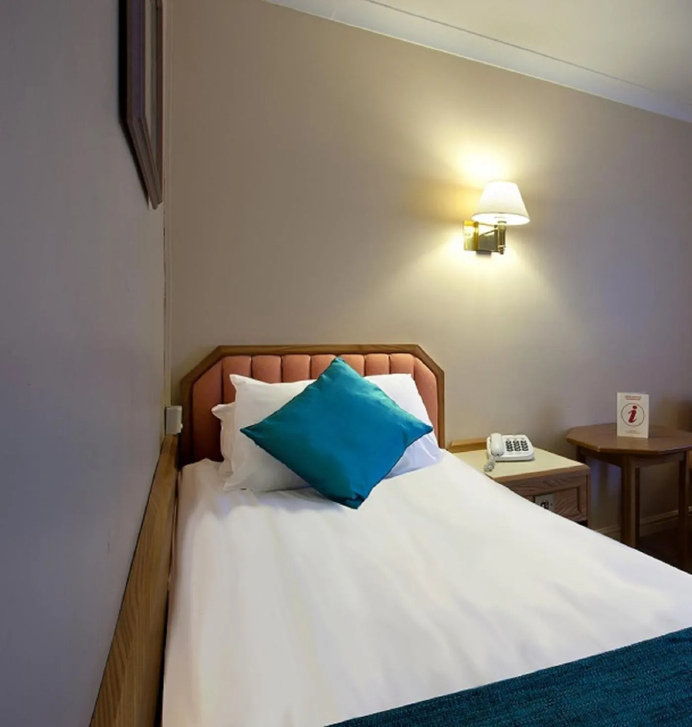 Bed in Royal Court Hotel