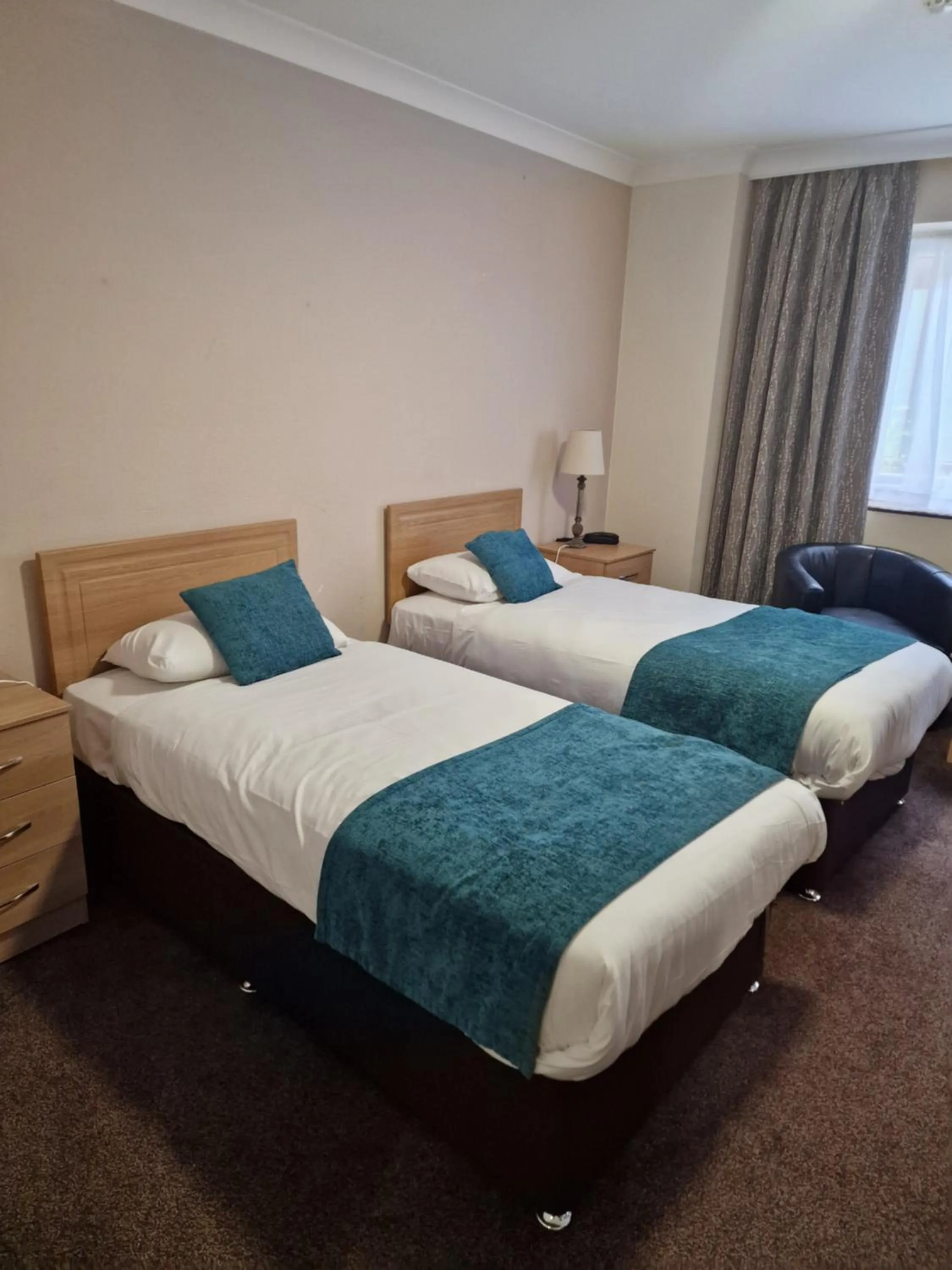 Bed in Royal Court Hotel