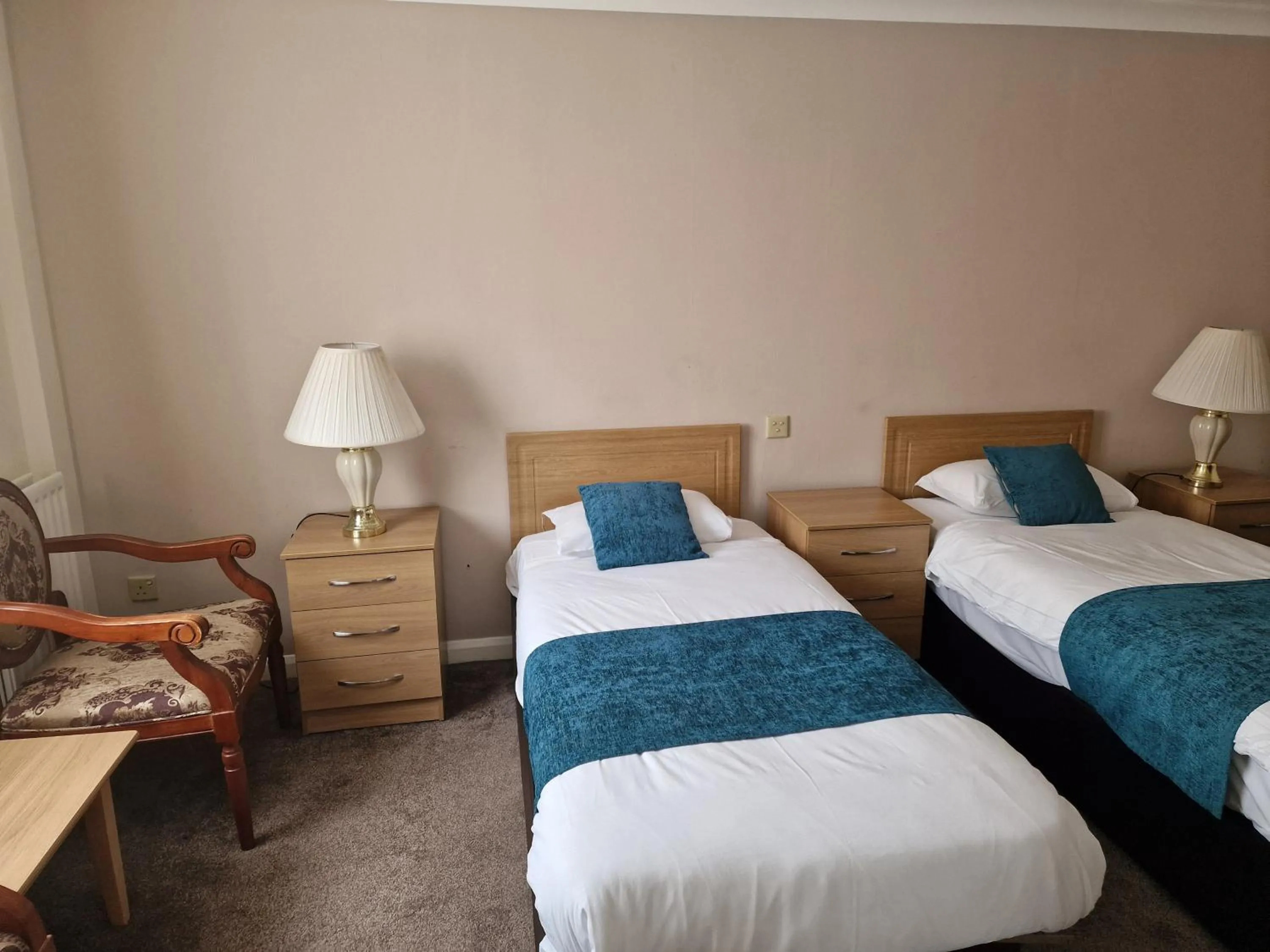 Bed in Royal Court Hotel