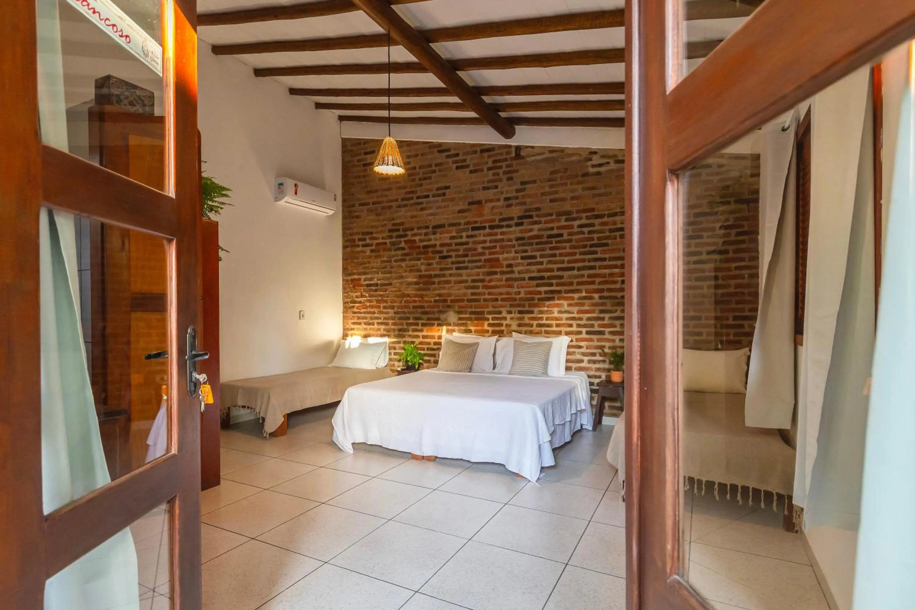 Bed in Pousada Arraial dos Sonhos